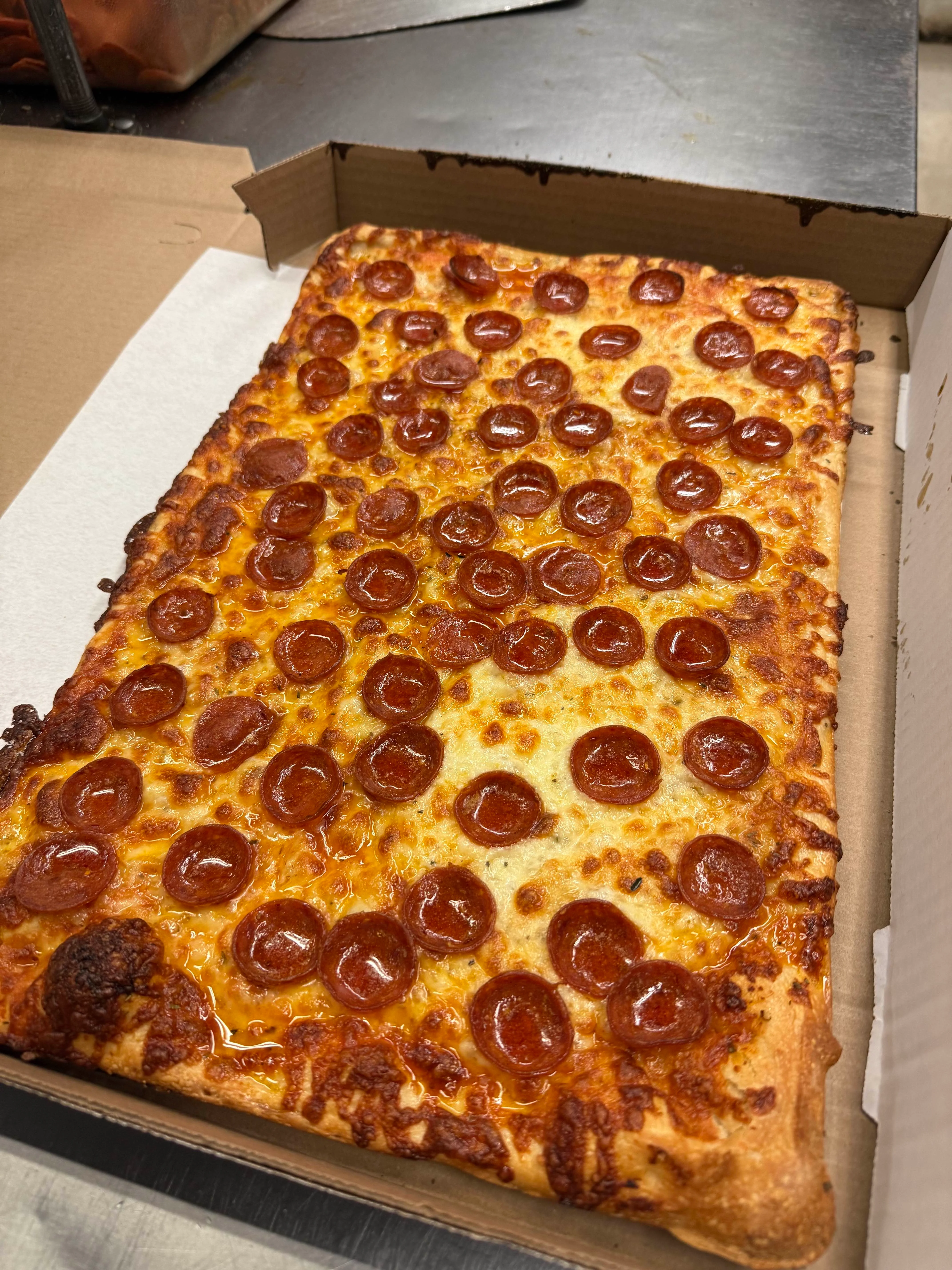 Pepperoni pizza in a classic rectangular style