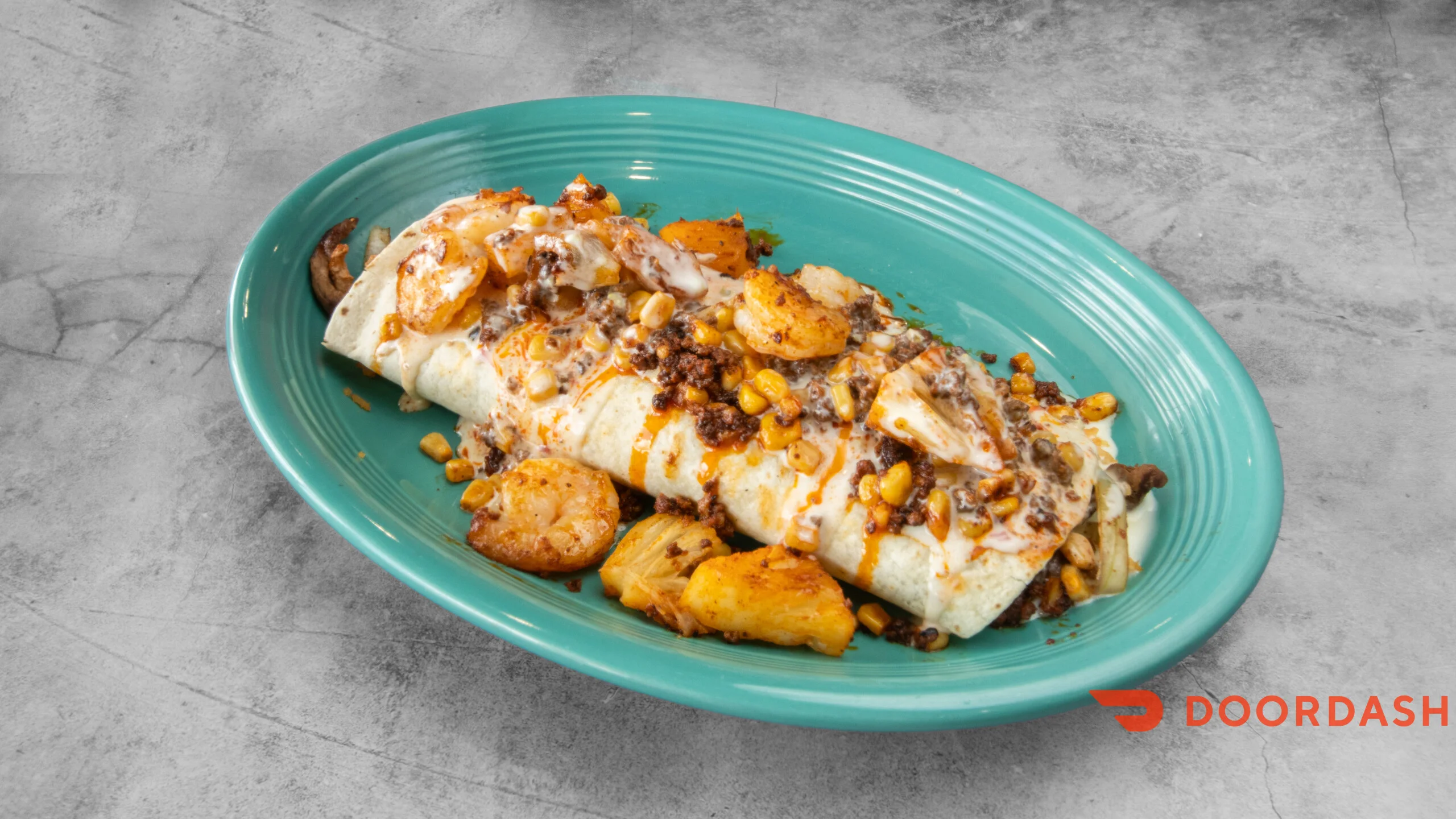 Delicious Mexican burrito topped with savory ingredients