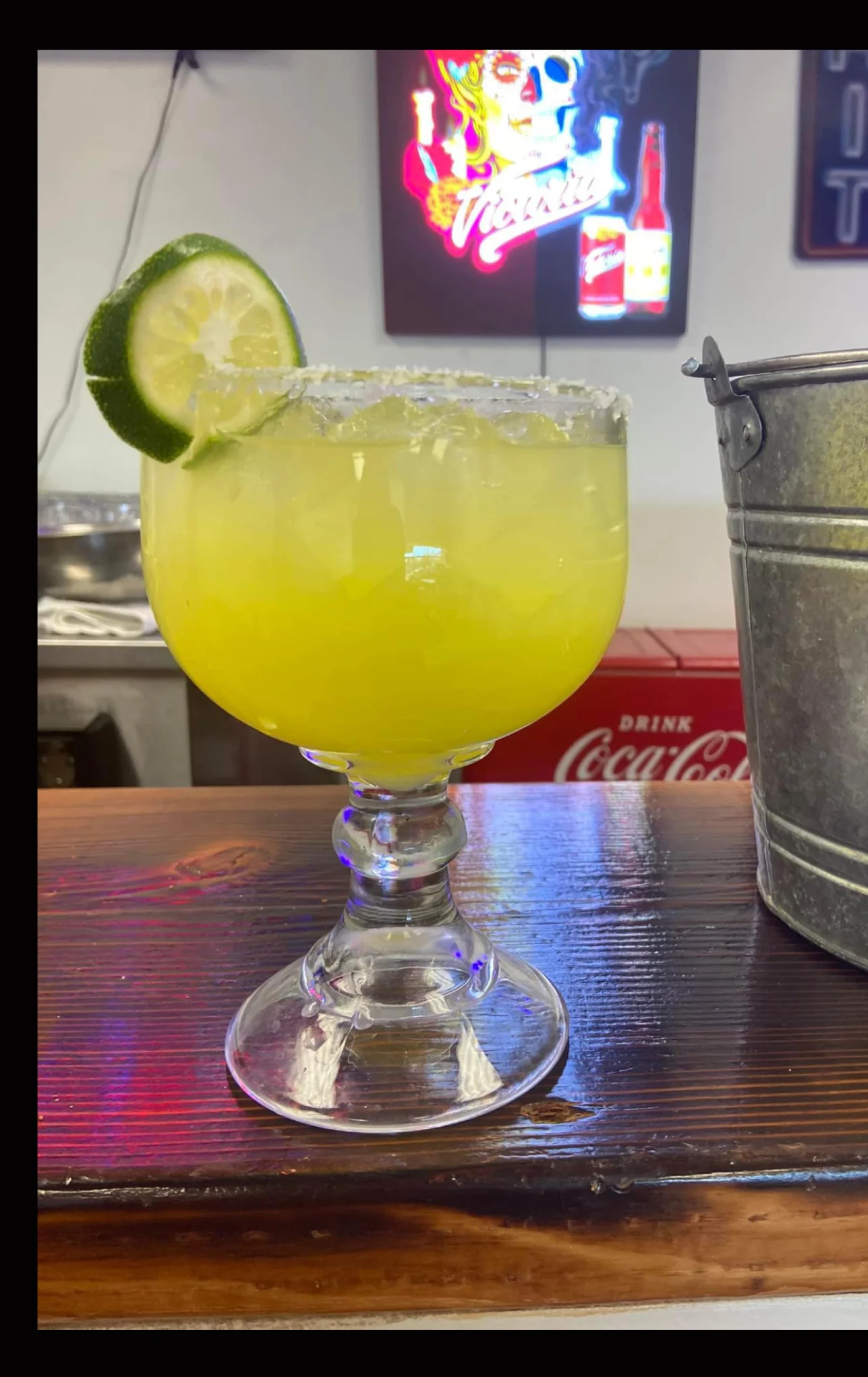 Vibrant margarita cocktail with lime garnish