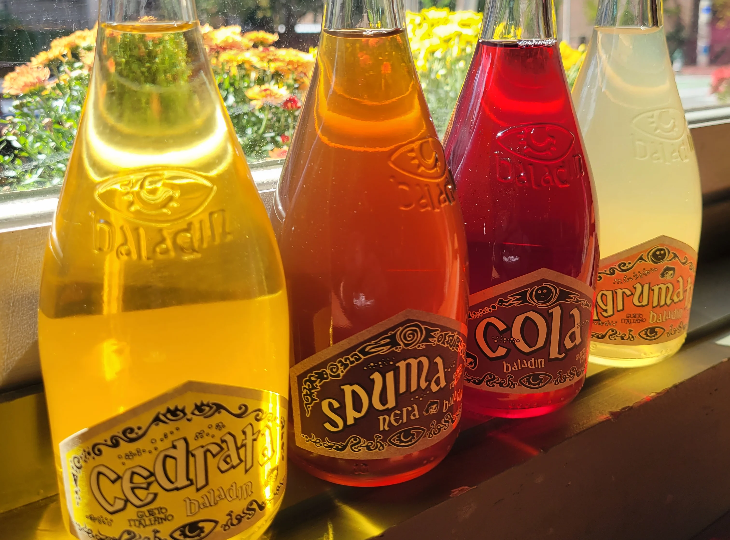 Italian soft drinks in colorful glass bottles