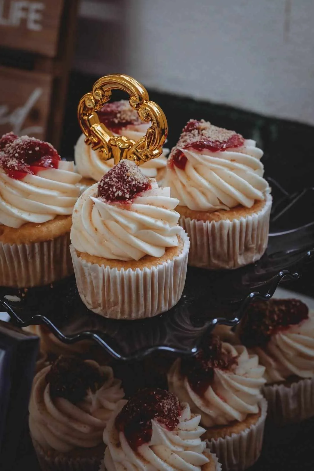 Delicious cupcakes with cream frosting and cherry topping