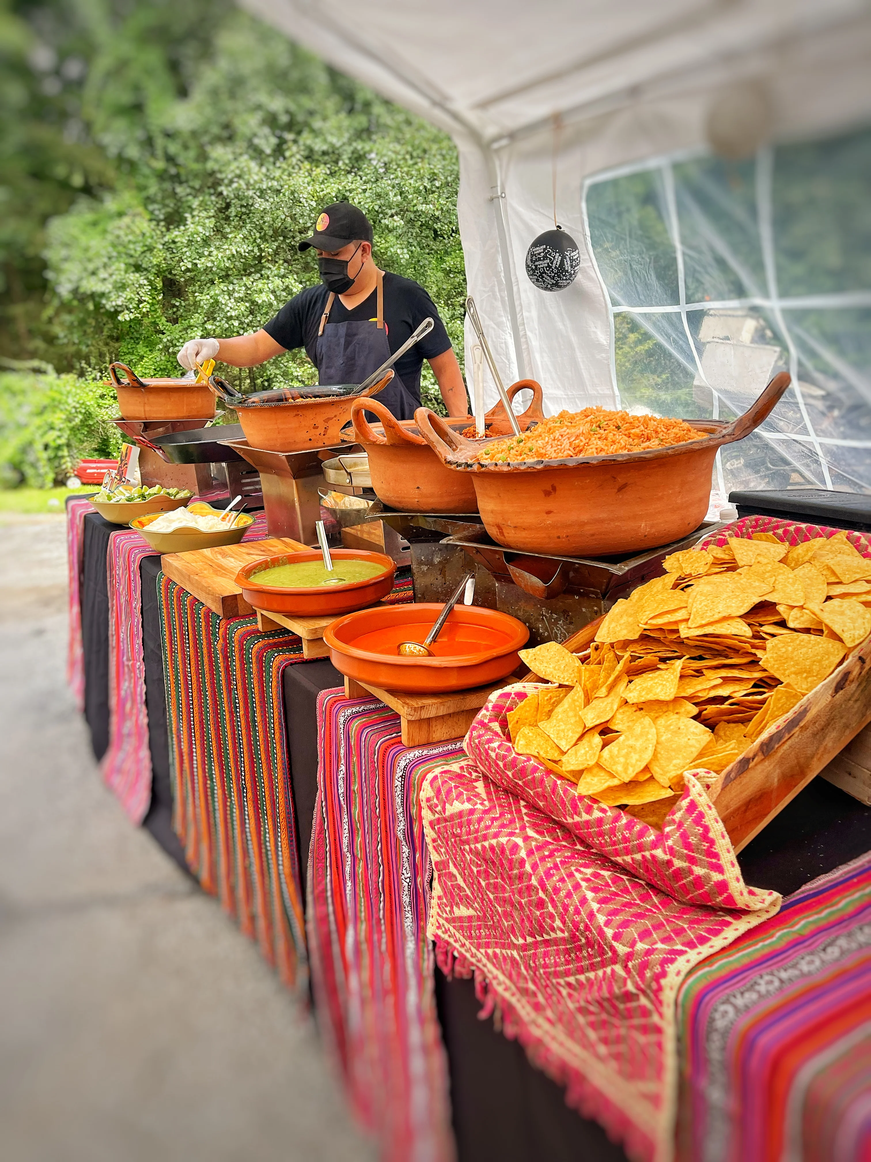 Mexican street food with tacos and salsas at a vibrant outdoor setup