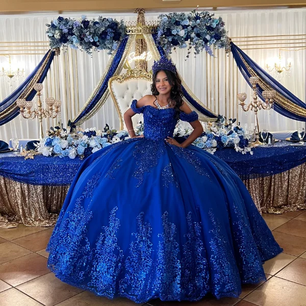 Elegant blue quinceañera dress with floral decorations
