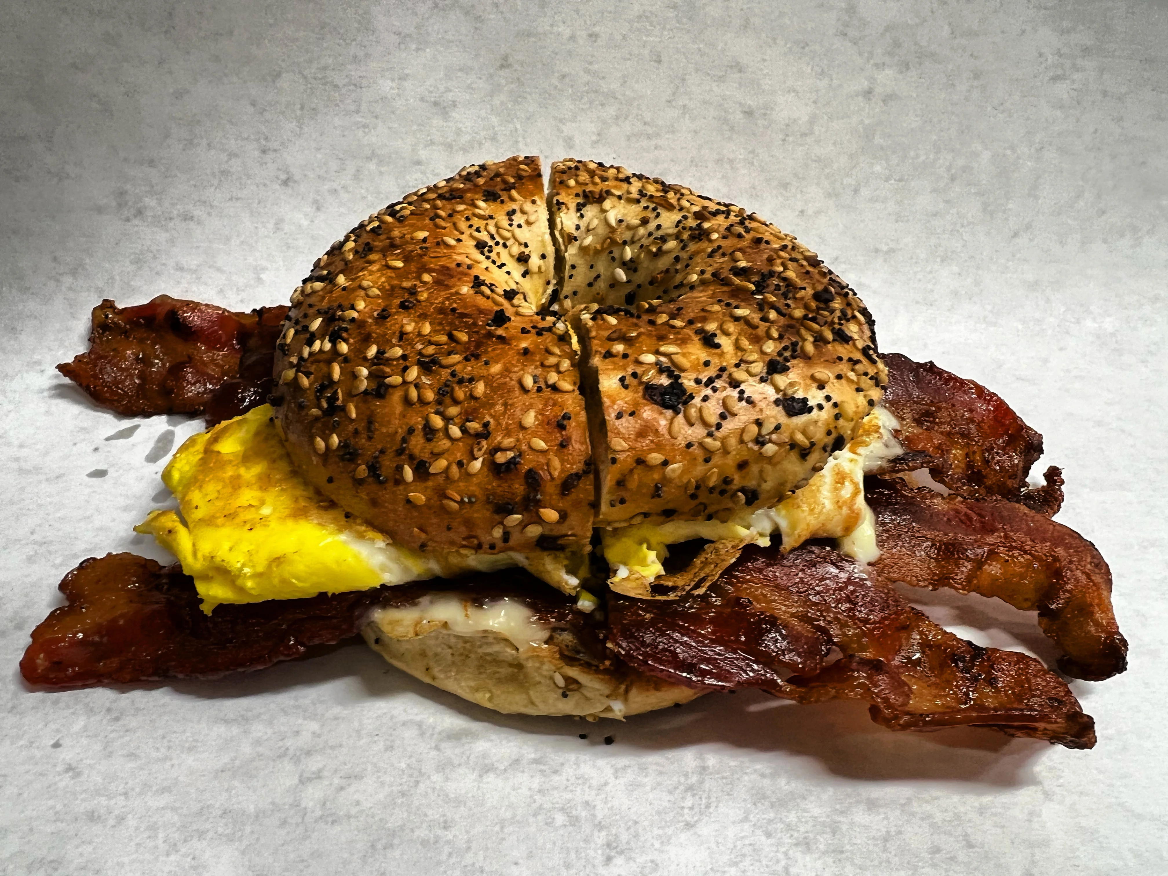 Bagel sandwich with bacon and egg, a classic breakfast dish