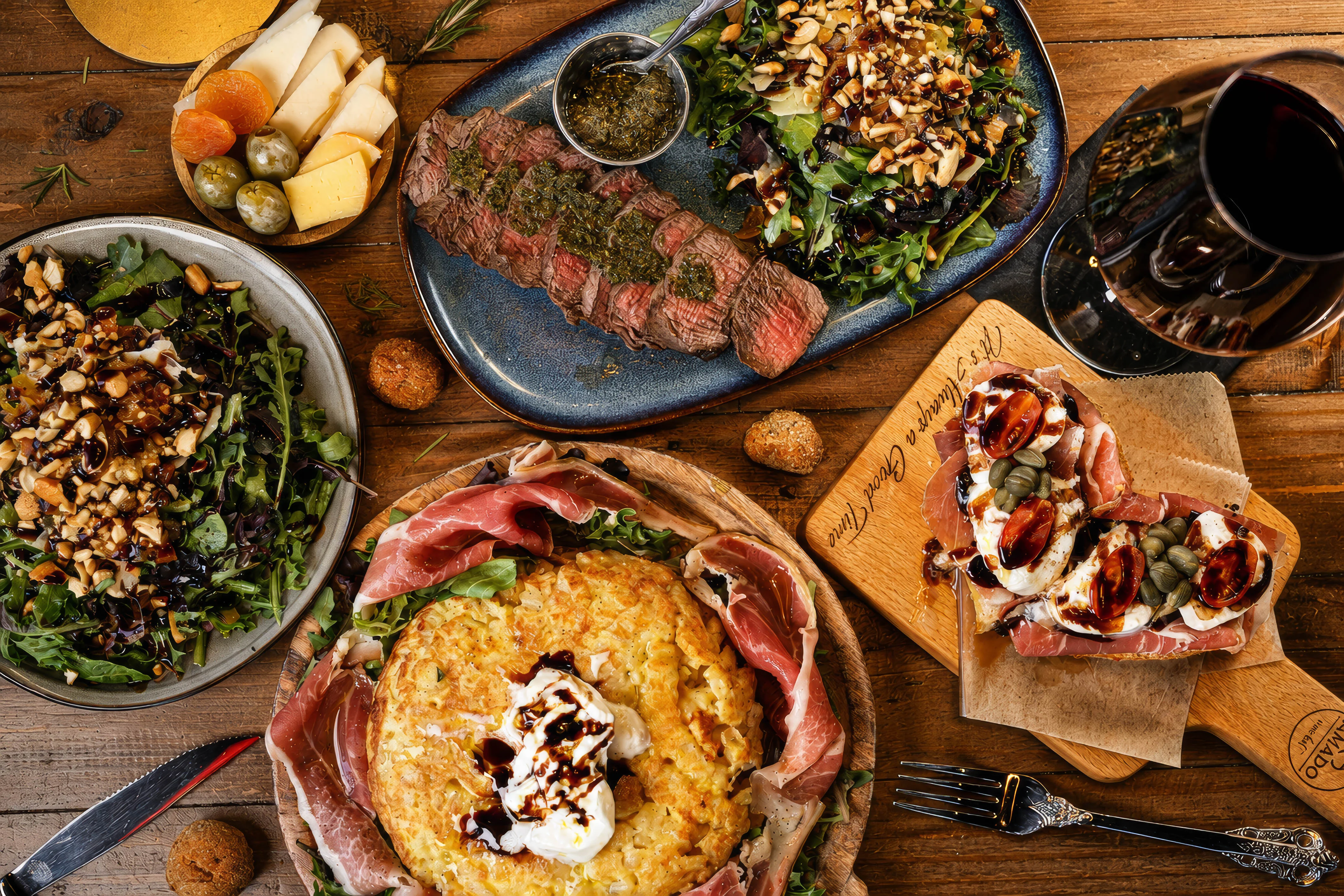 Italian antipasto platter with steak and salads
