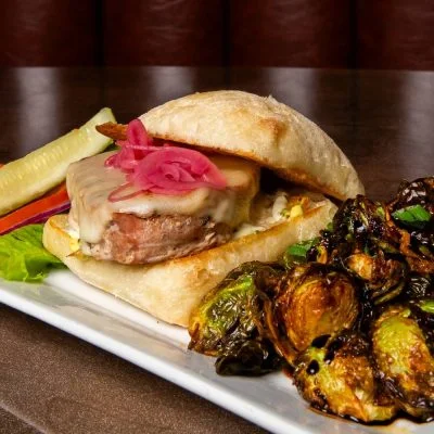 Savory Cuban sandwich with pickled onions and Brussels sprouts