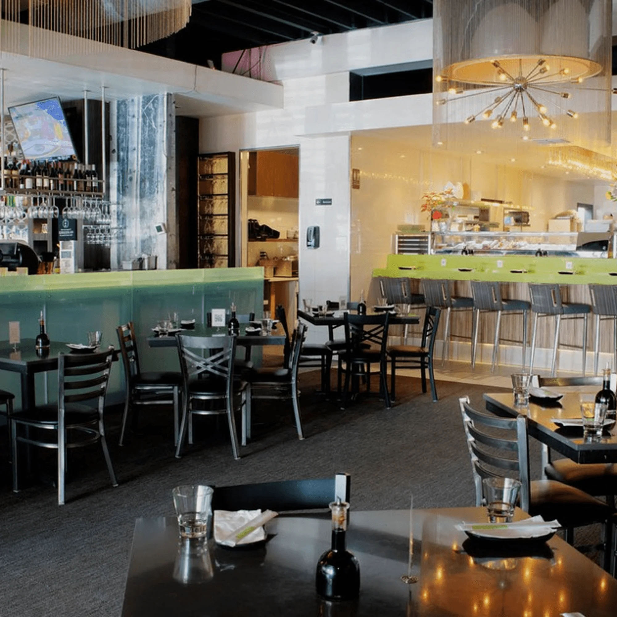 Modern restaurant interior with stylish decor and bar area
