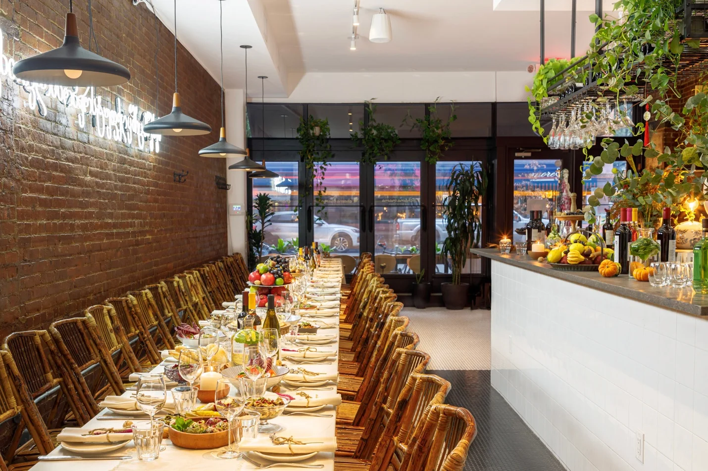 Elegant restaurant interior with long dining table and warm lighting