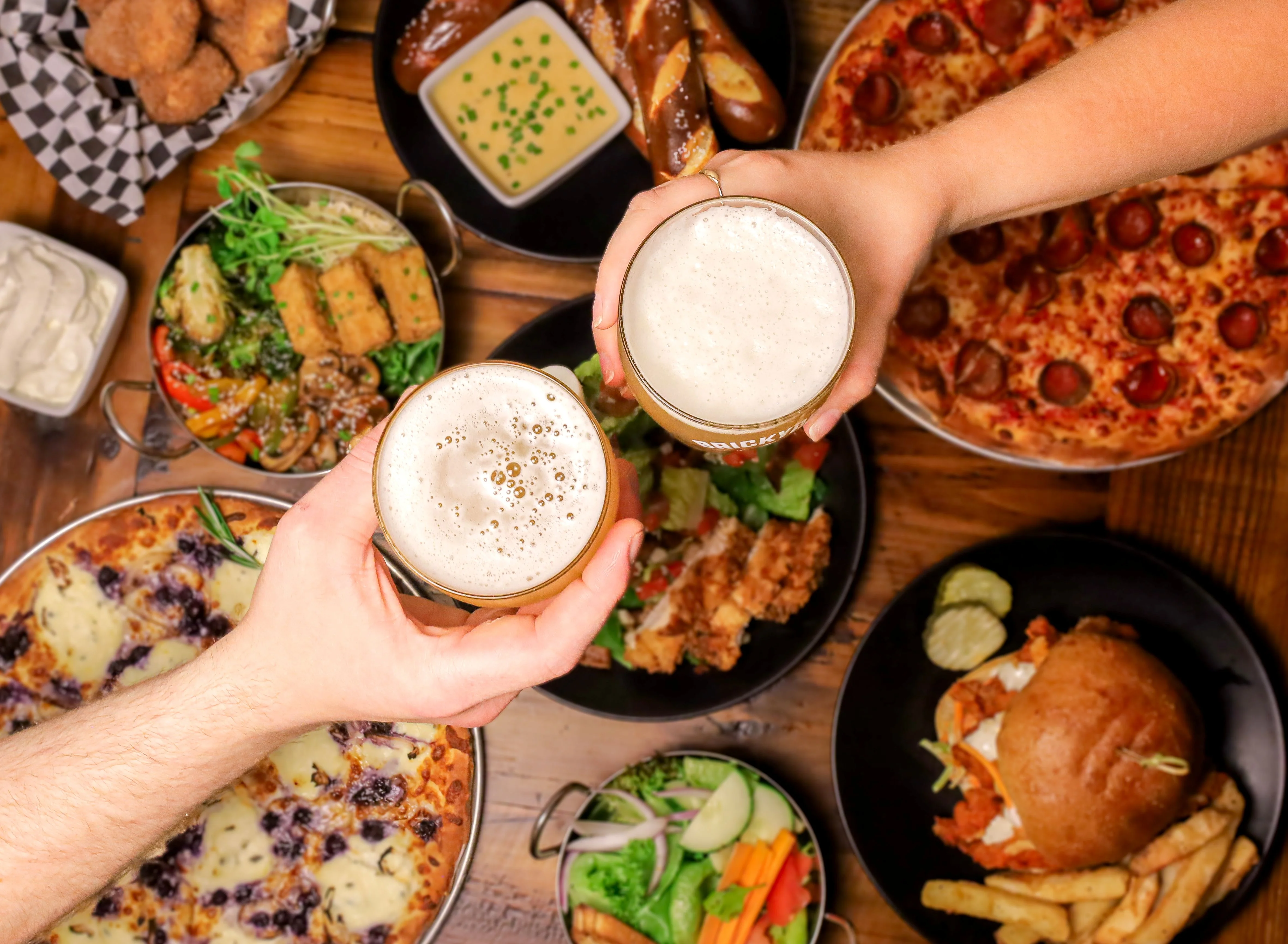 Cheers with craft beers and a variety of dishes in a lively restaurant setting