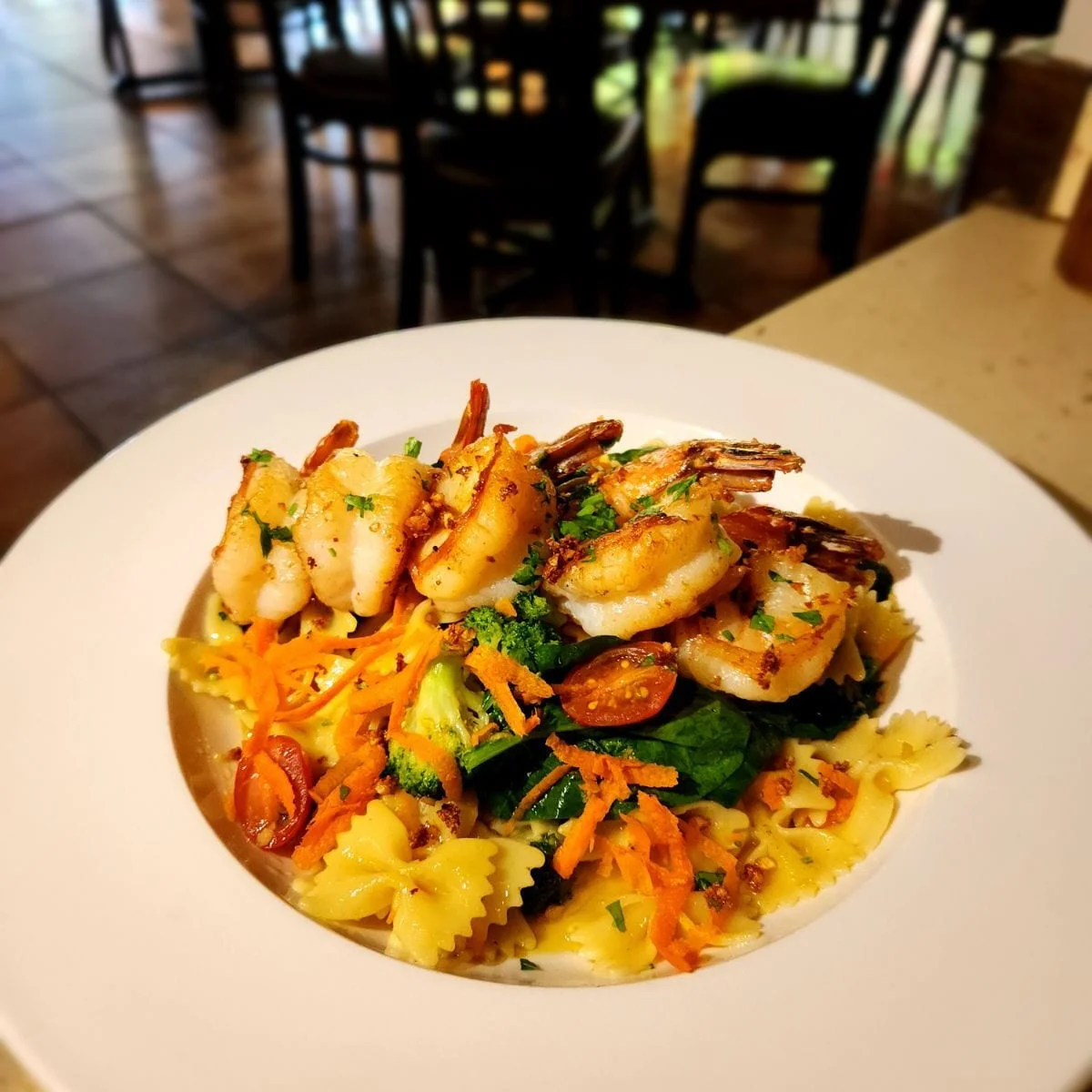 Shrimp pasta dish with vegetables in a creamy sauce