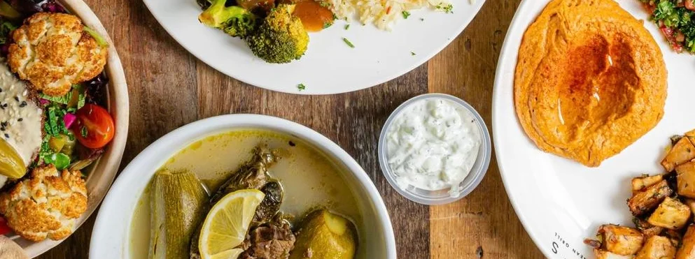 Middle Eastern food spread with group dining promotion