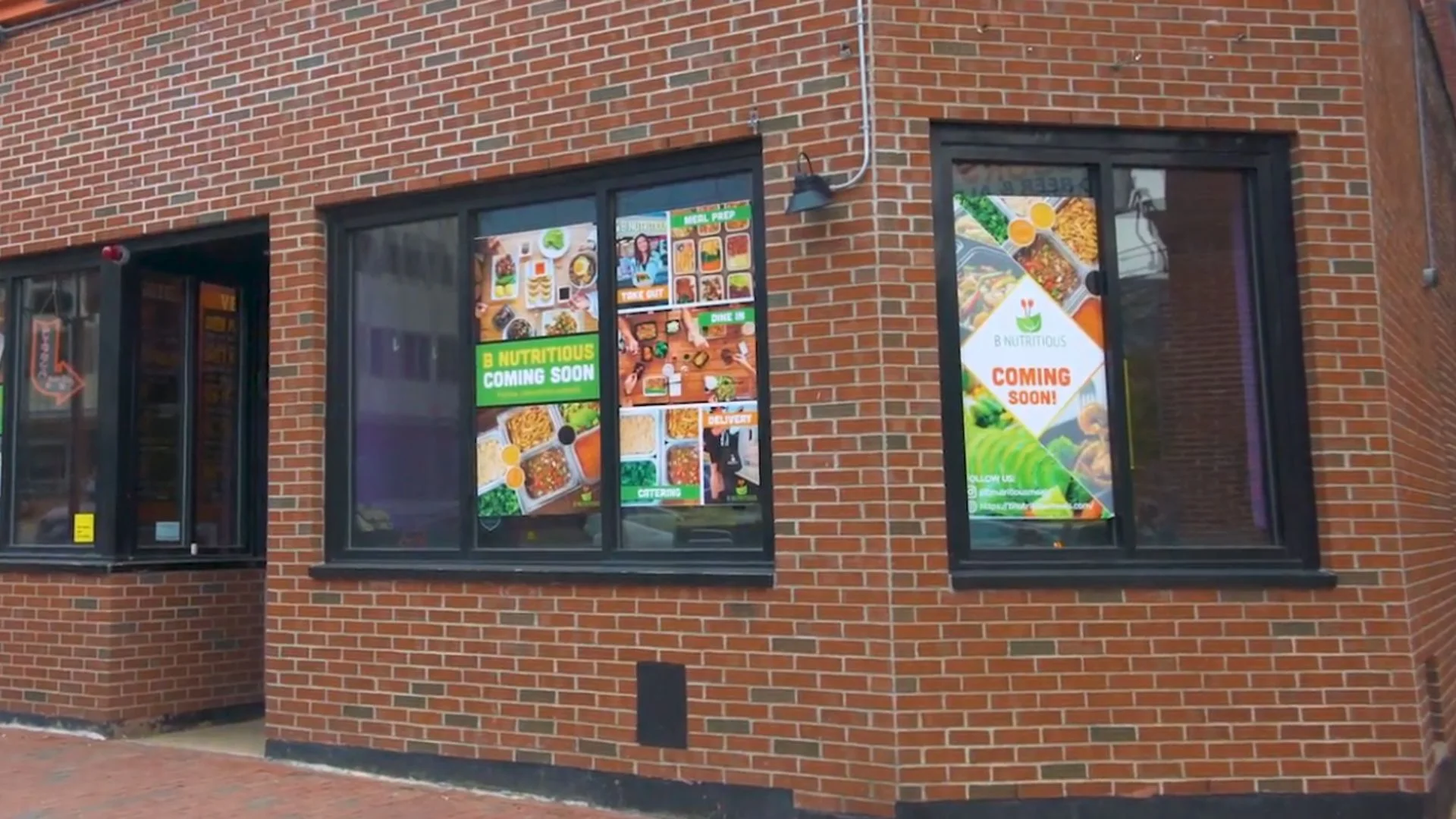 Restaurant exterior with promotional signs for B Nutritious
