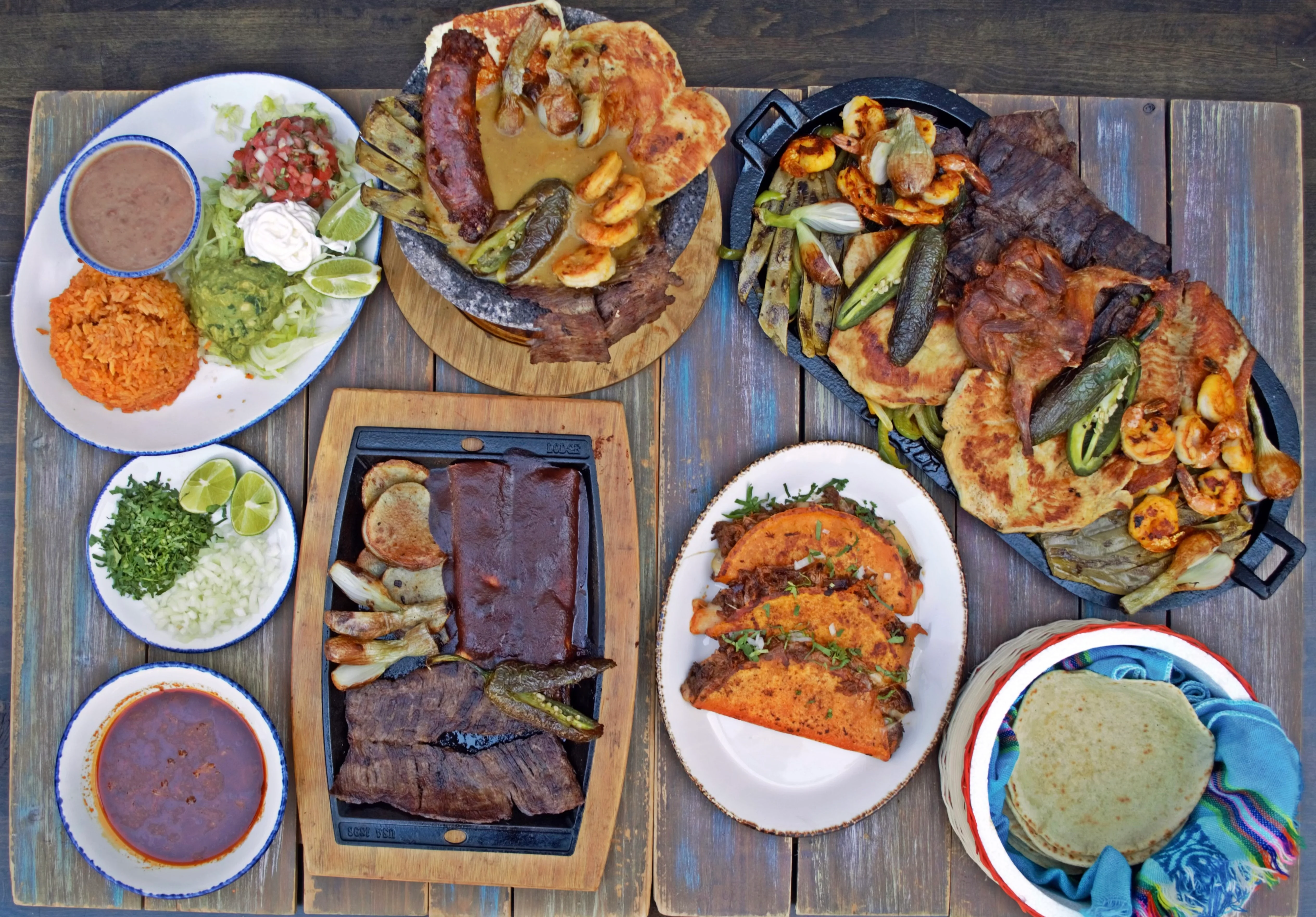 Delicious gourmet burger with fresh ingredients on a wooden table.