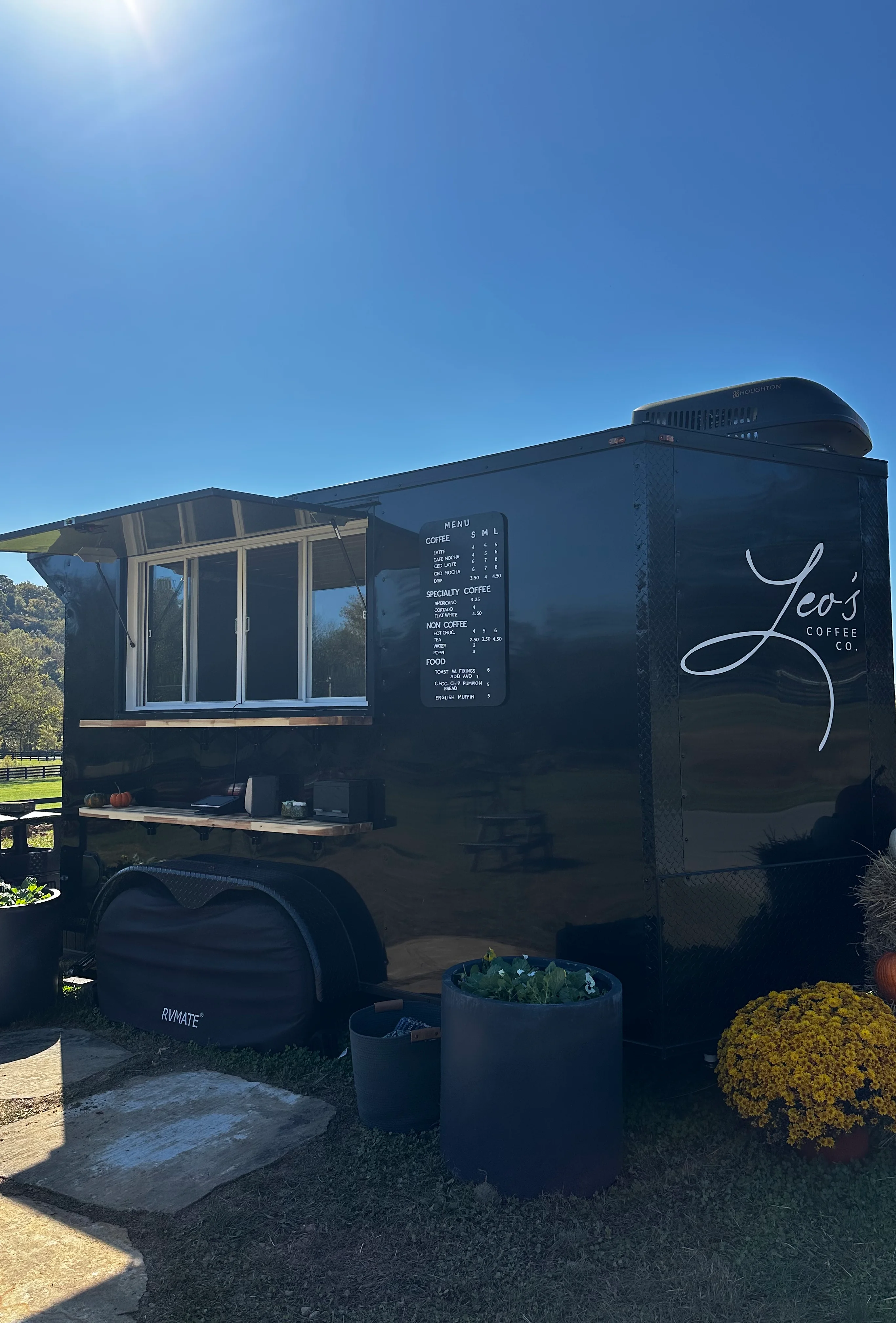 Coffee trailer serving specialty brews in a scenic outdoor setting