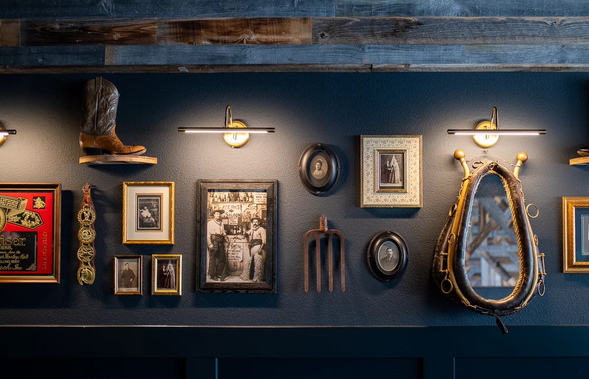Rustic restaurant wall decor with vintage items and framed photos