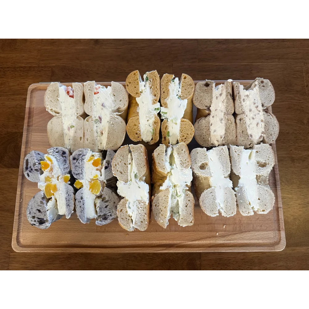 Assorted Japanese cream-filled sandwiches on a wooden platter