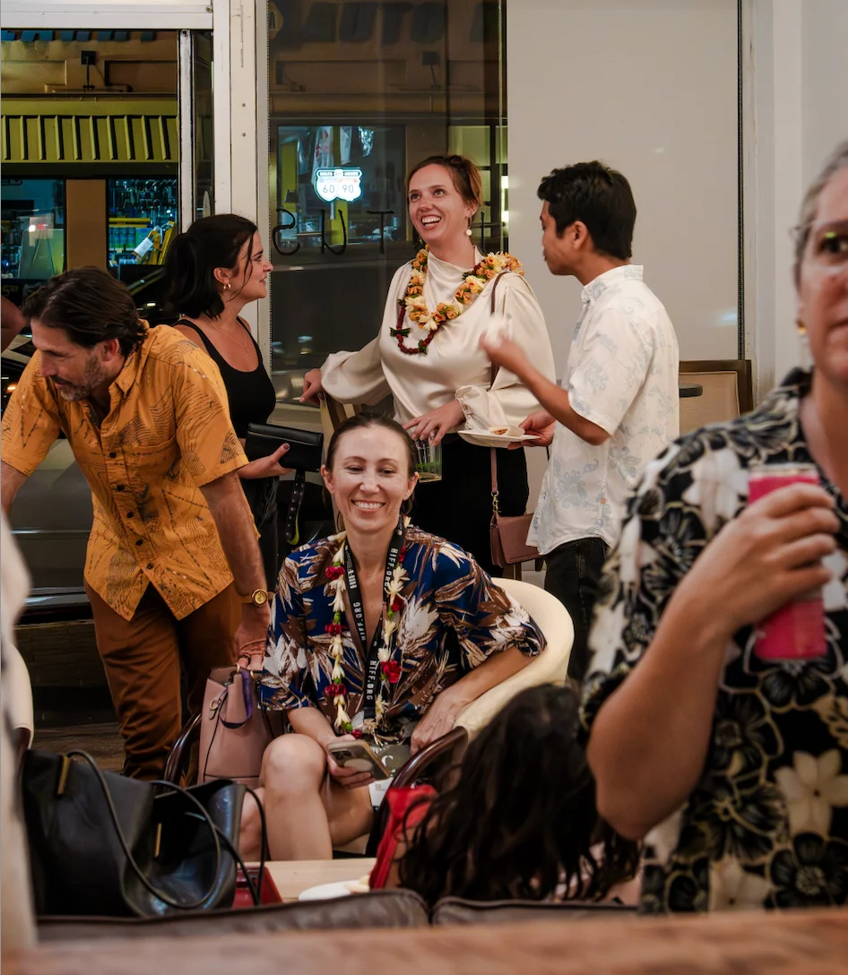 Group of friends enjoying a lively conversation at a restaurant