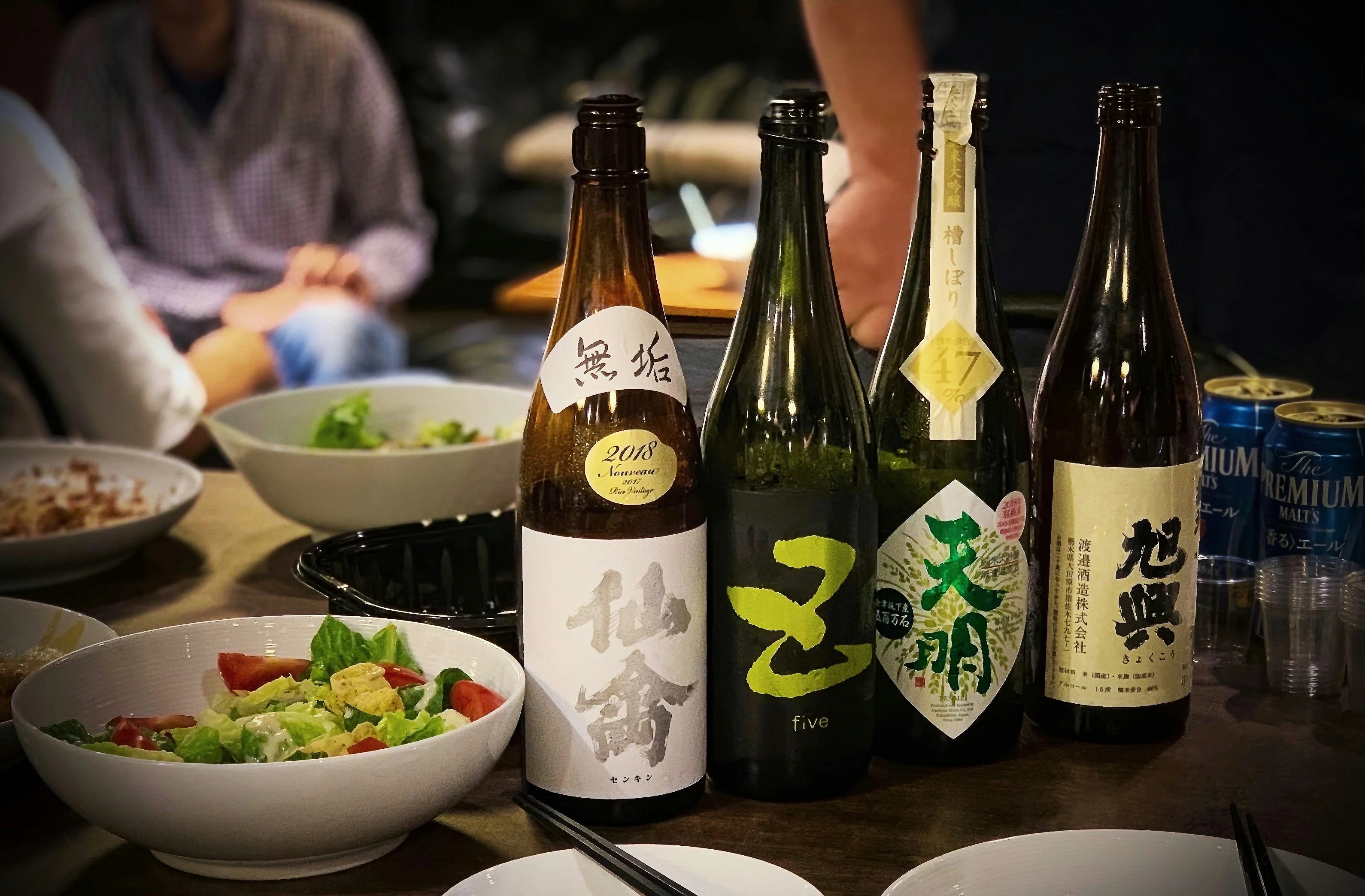 Selection of premium Japanese sake bottles on a dining table