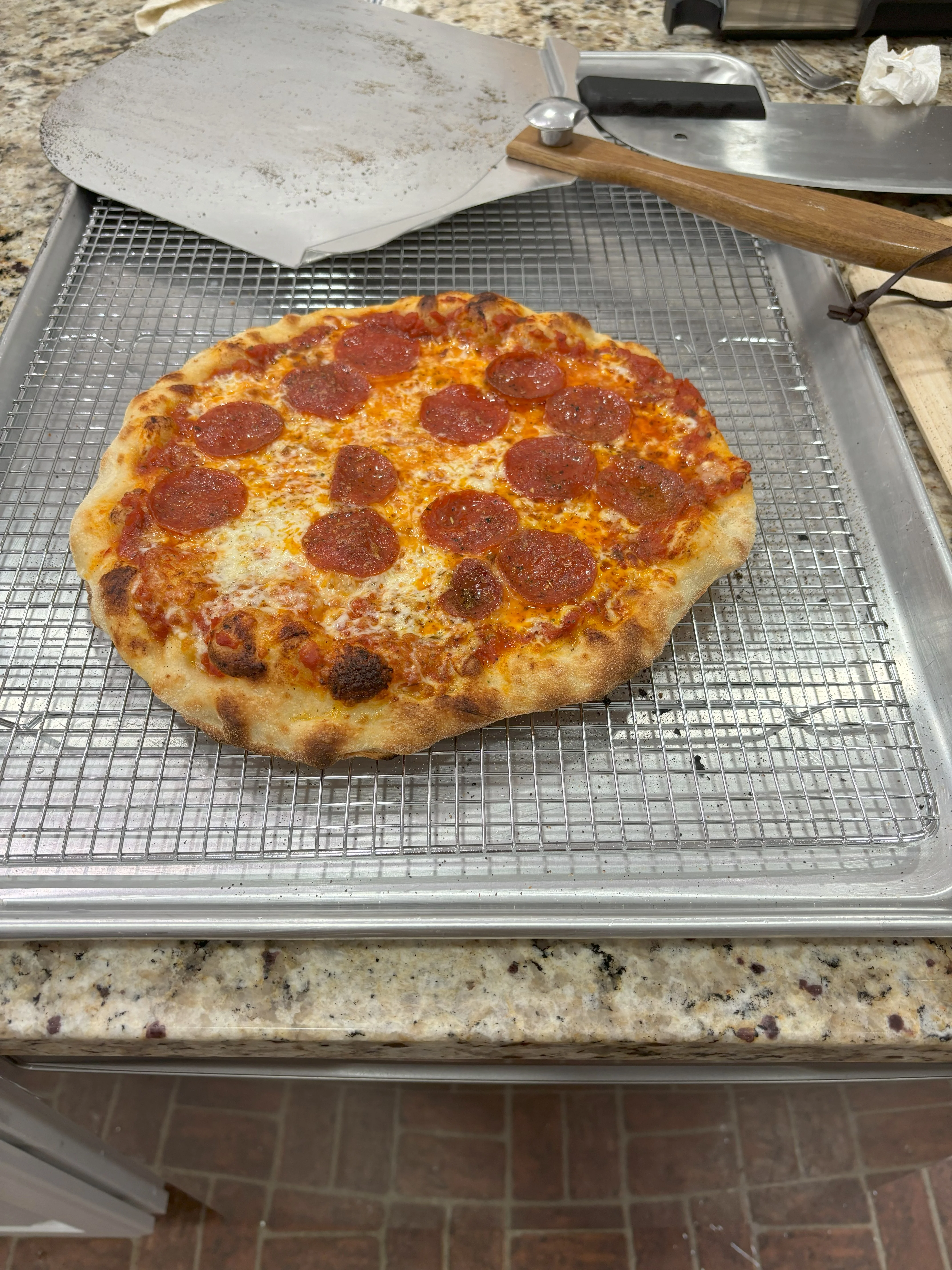 Pepperoni pizza on a cooling rack