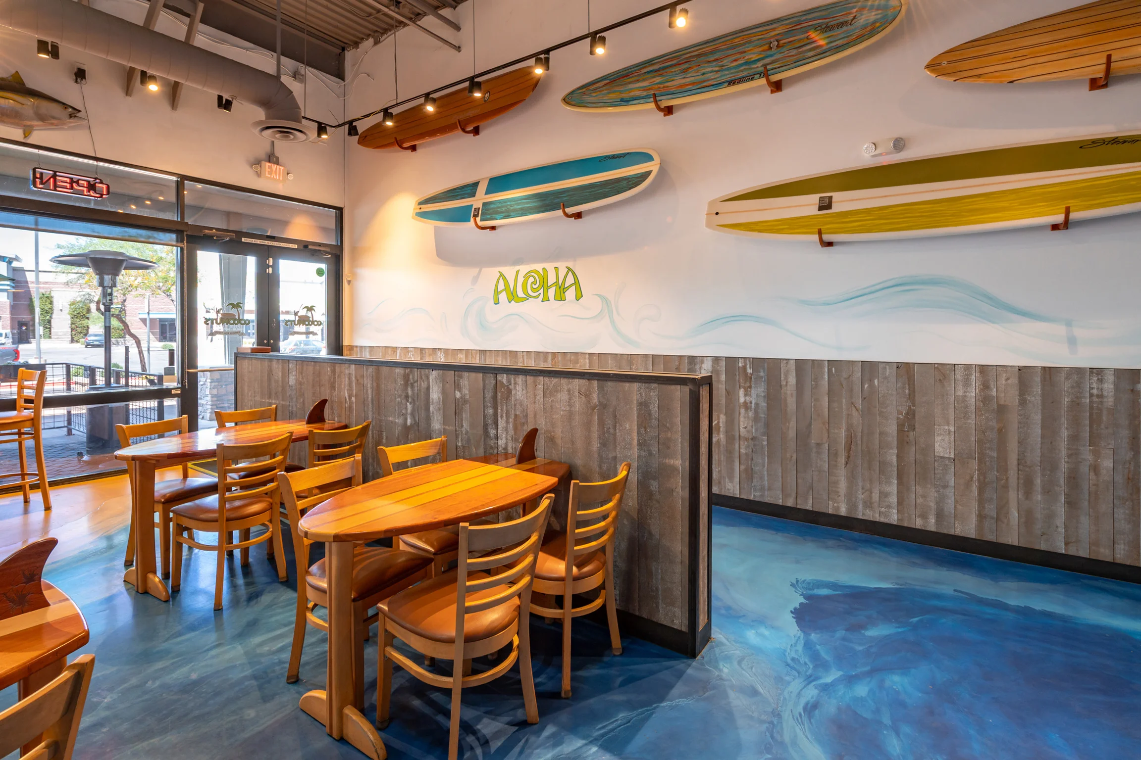 Cozy restaurant interior with surfboards and wooden decor