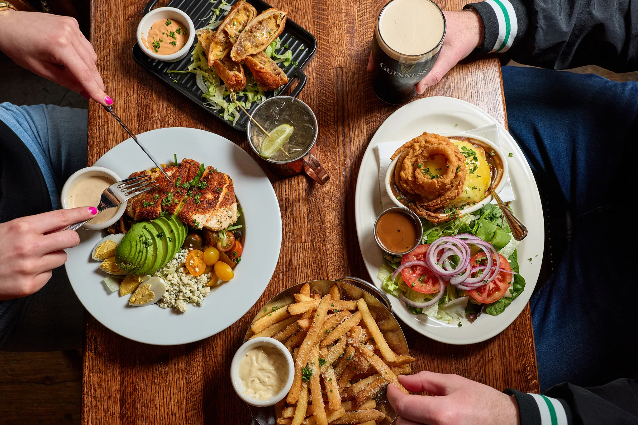 Grilled chicken salad with avocado and crispy onion rings