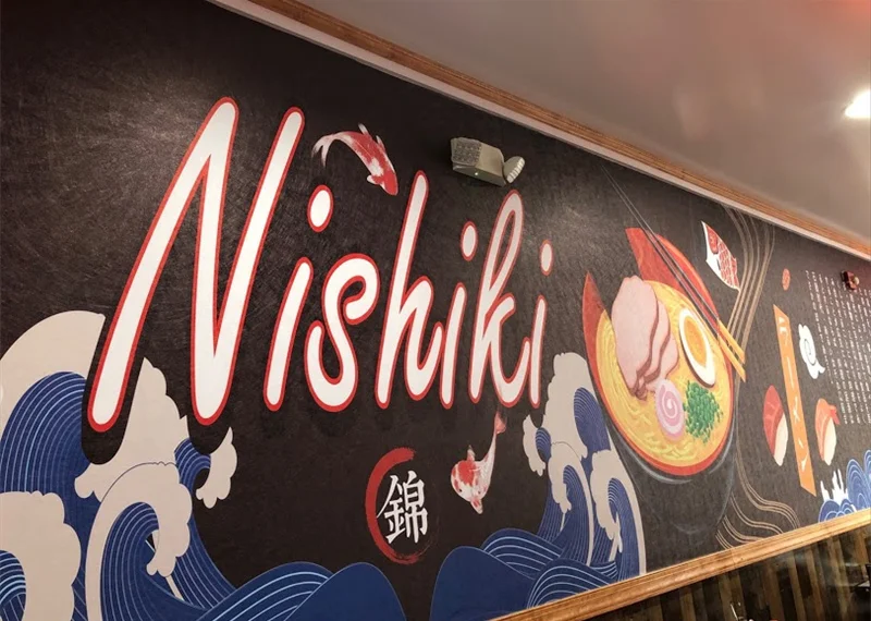 Vibrant mural featuring Japanese ramen and koi fish at Nishiki restaurant