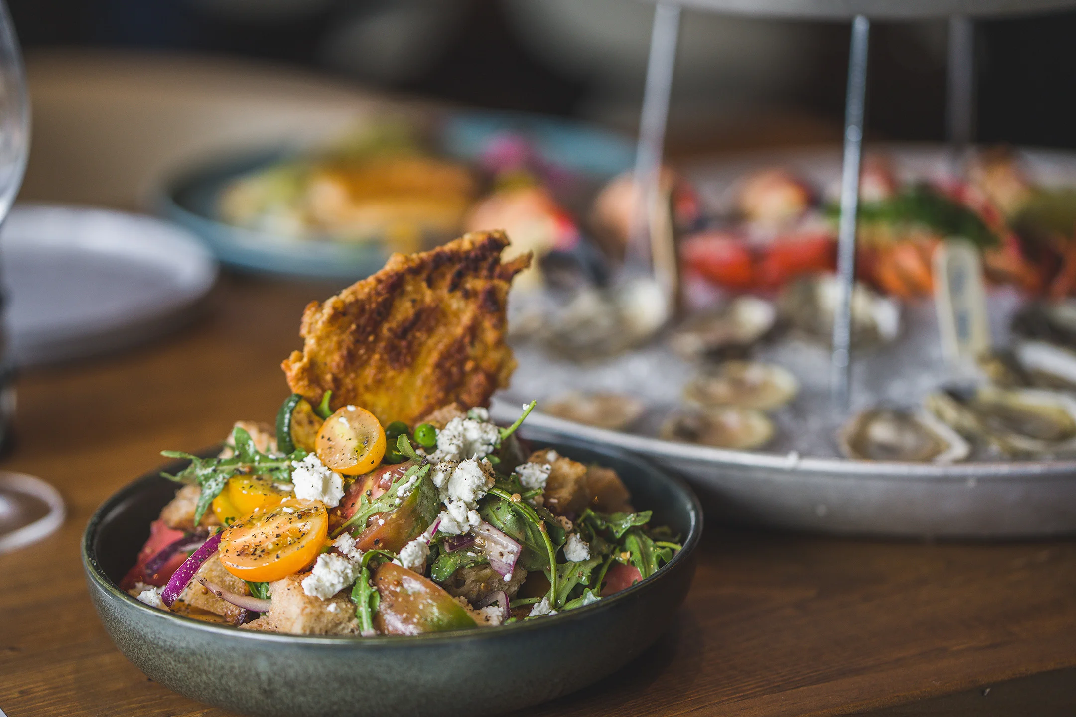 Colorful Mediterranean panzanella salad with crispy bread
