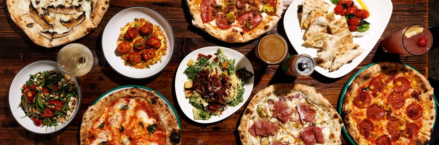 Wood-fired pizza with fresh toppings from a traditional oven