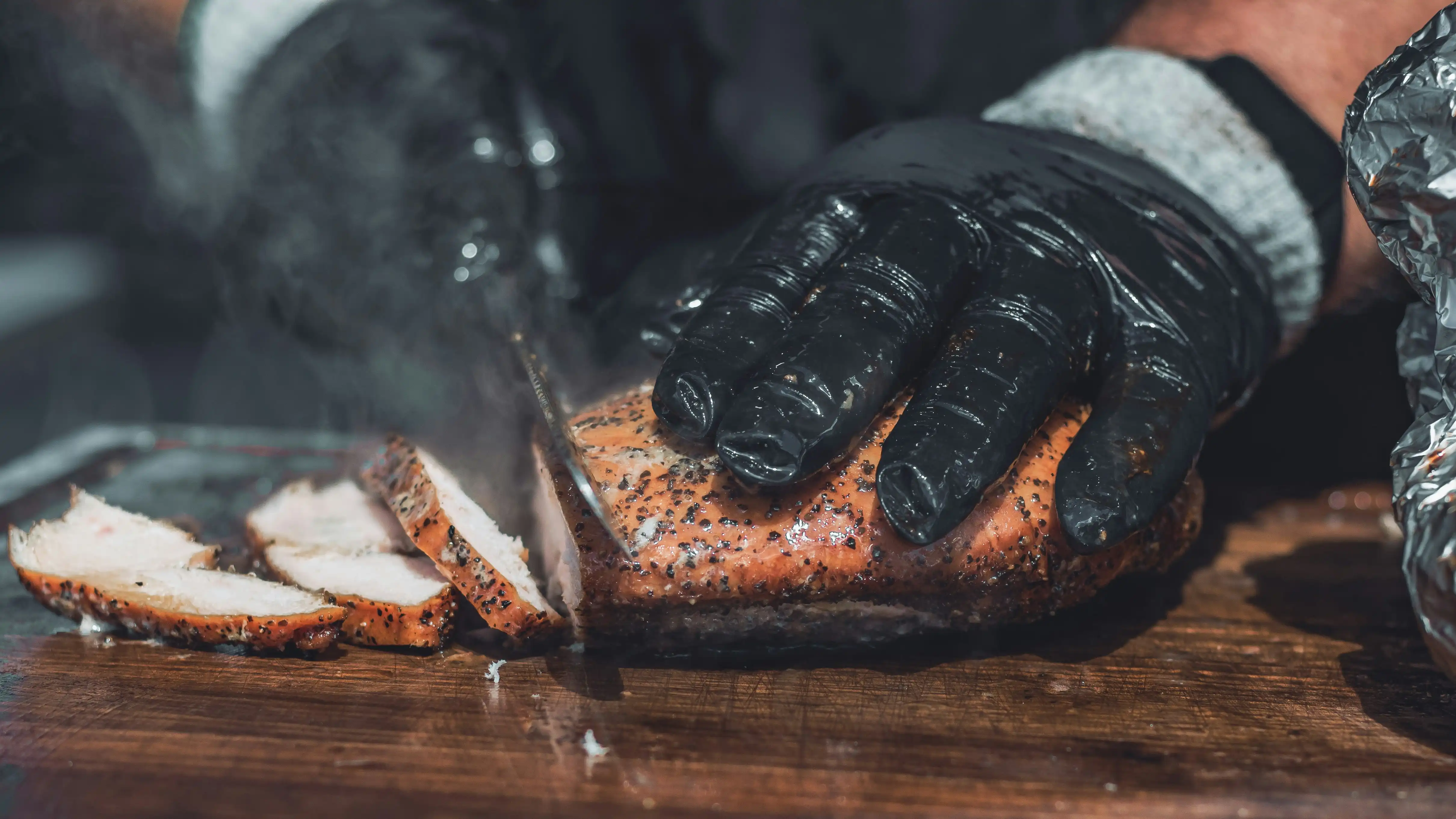 slicing juicy smoked chicken breast