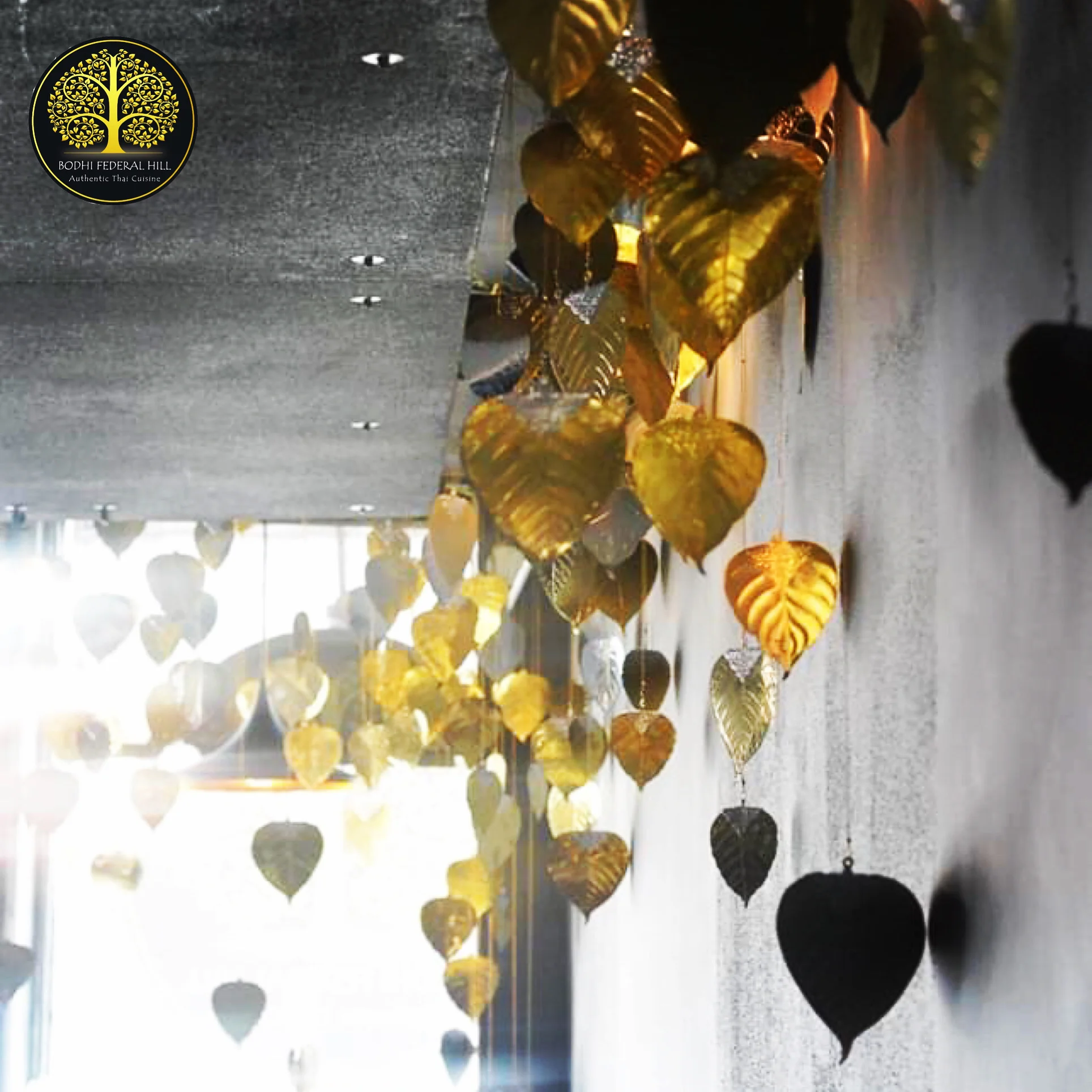Decorative golden and black leaf ornaments in a restaurant interior
