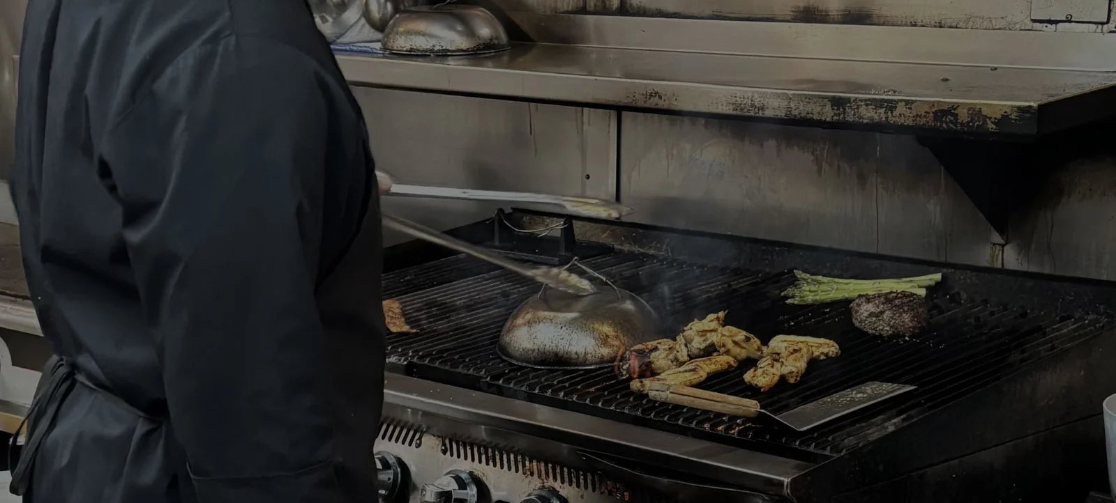 A restaurant chef preparing a dish