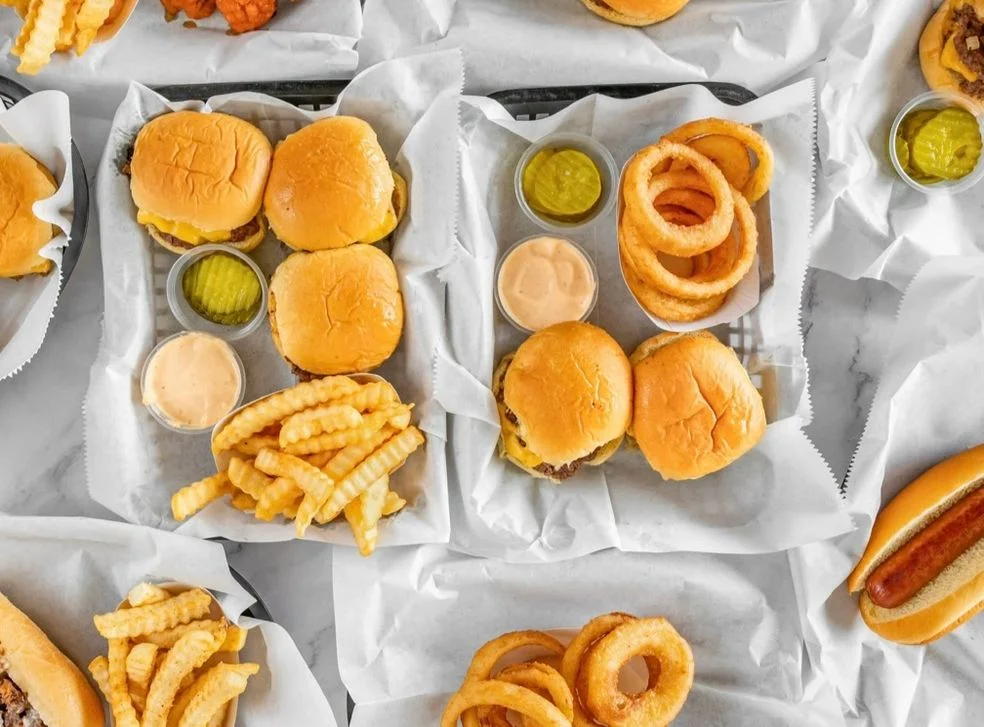 Classic American sliders with fries and onion rings