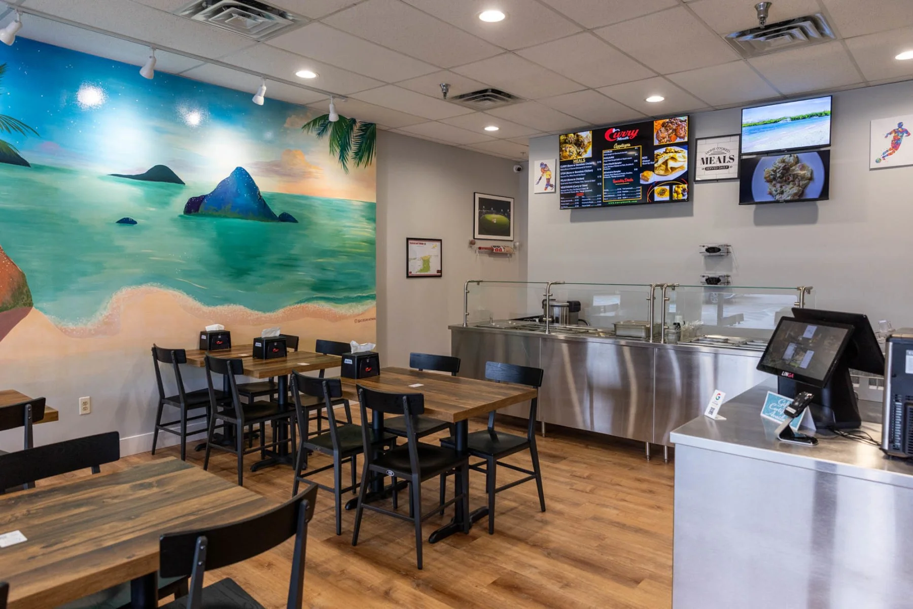 Cozy restaurant interior with beach mural and modern decor
