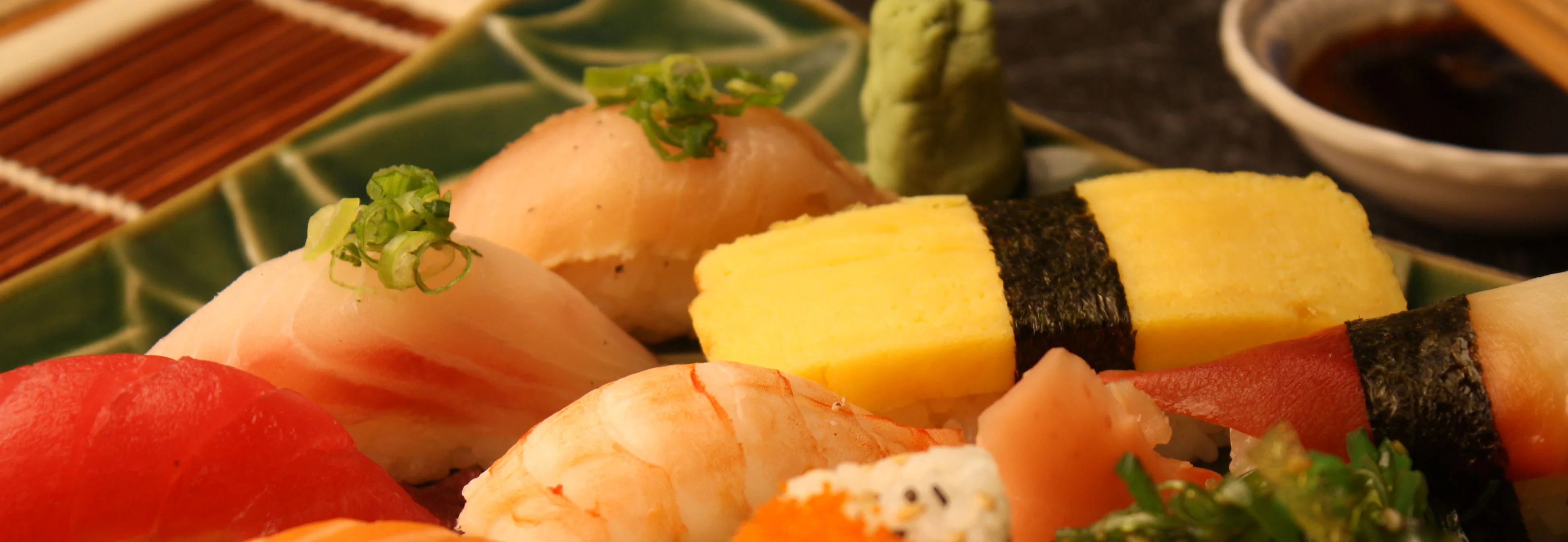 Assorted sushi platter featuring nigiri and rolls