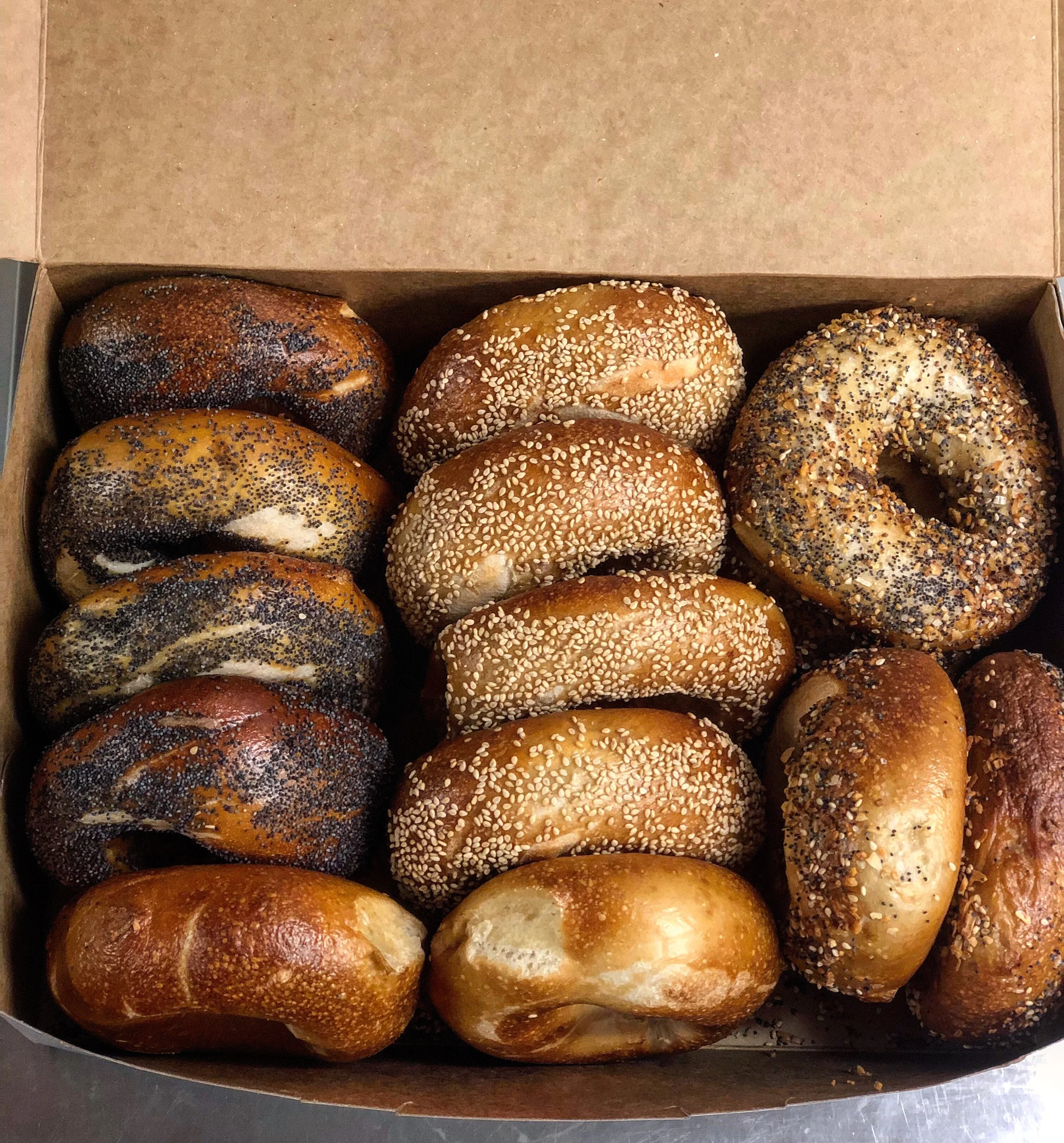 Assorted bagels in a bakery box