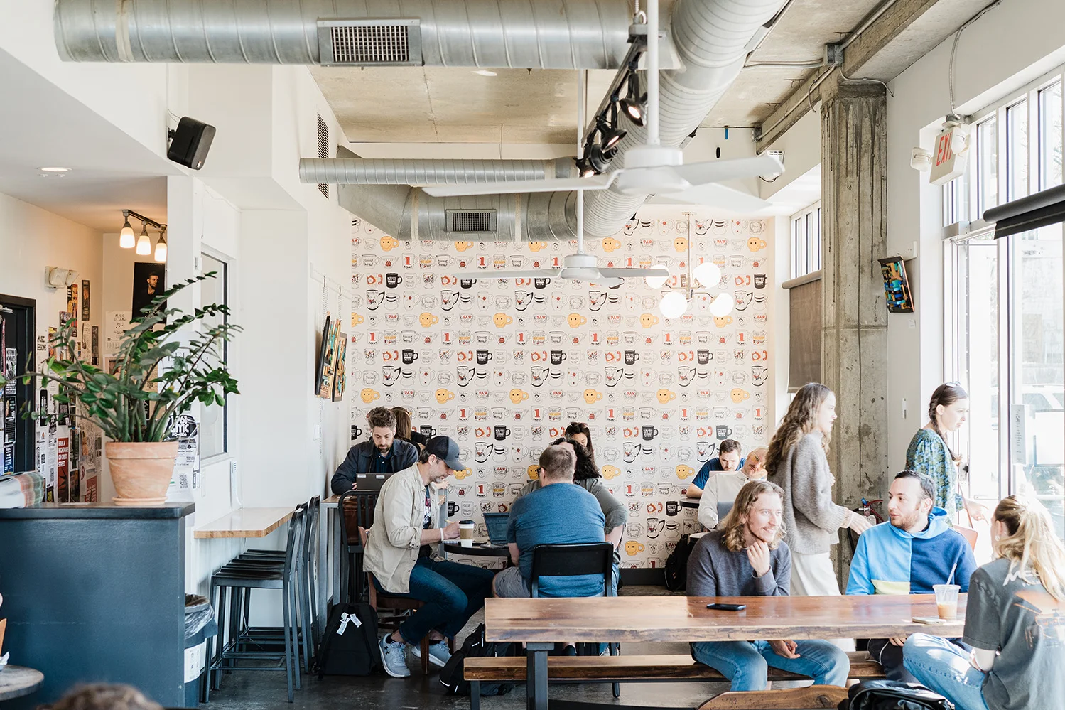 Cozy restaurant interior with modern decor and patrons enjoying their meals
