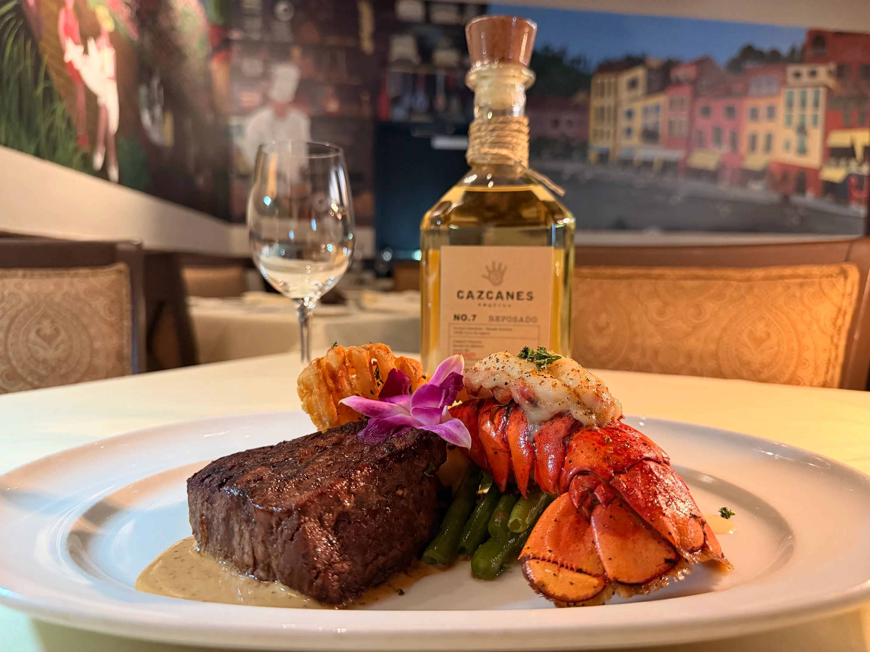 Surf and turf featuring steak and lobster tail in a fine dining setting