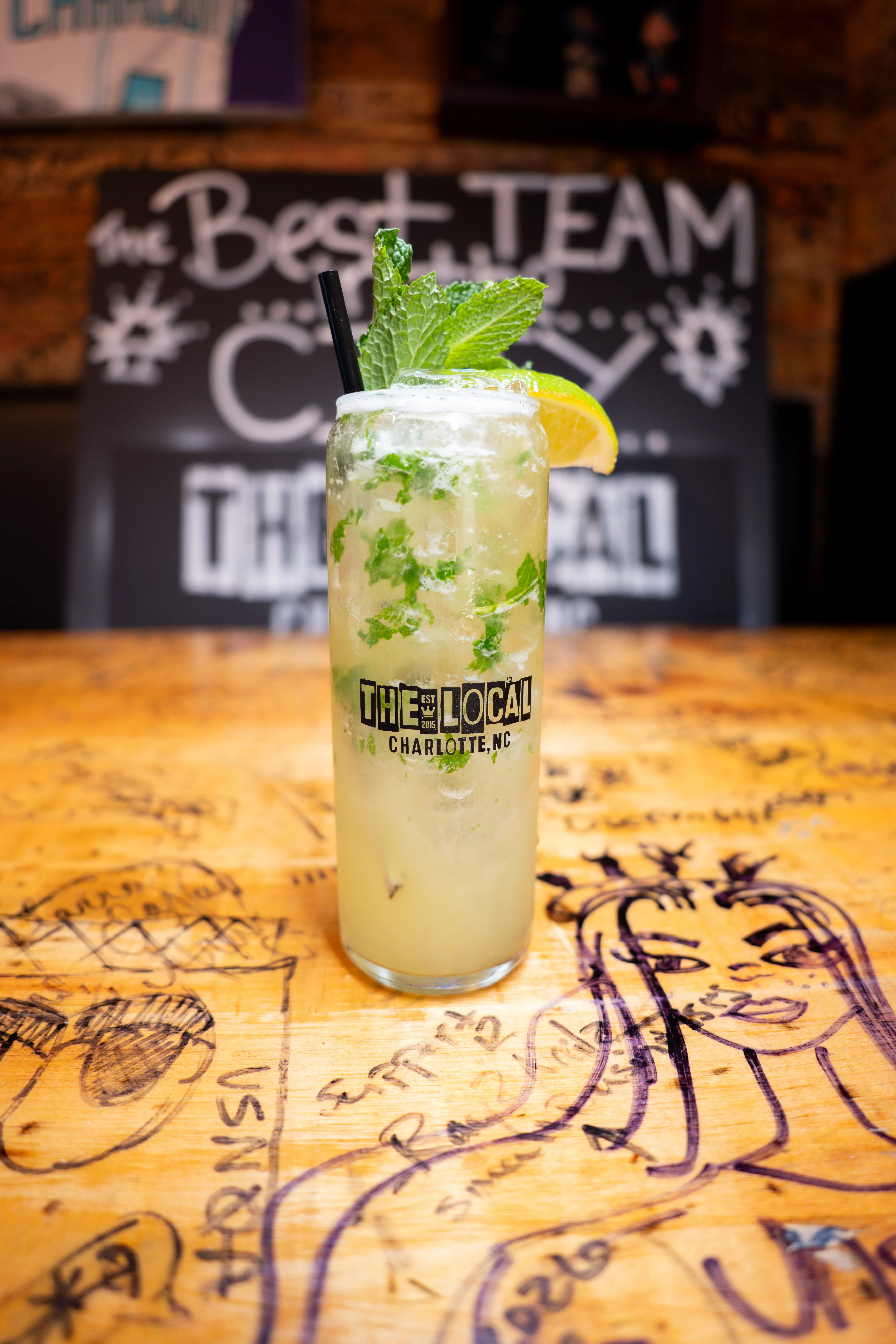 Refreshing mojito cocktail with mint and lemon in a bar setting