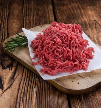 A plate of cooked ground beef, seasoned and ready to serve.