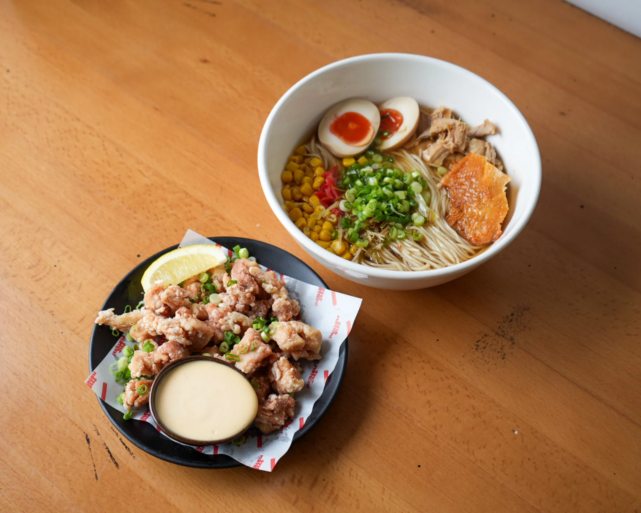 Japanese ramen bowl with fried chicken and dipping sauce