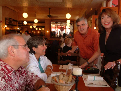 Cozy restaurant interior with diners enjoying a meal and warm lighting