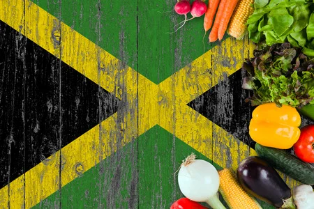 A vibrant Jamaican dish featuring colorful ingredients and garnishes.