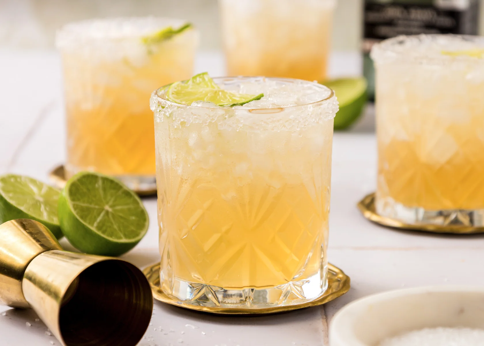 Refreshing margarita cocktails with lime garnish