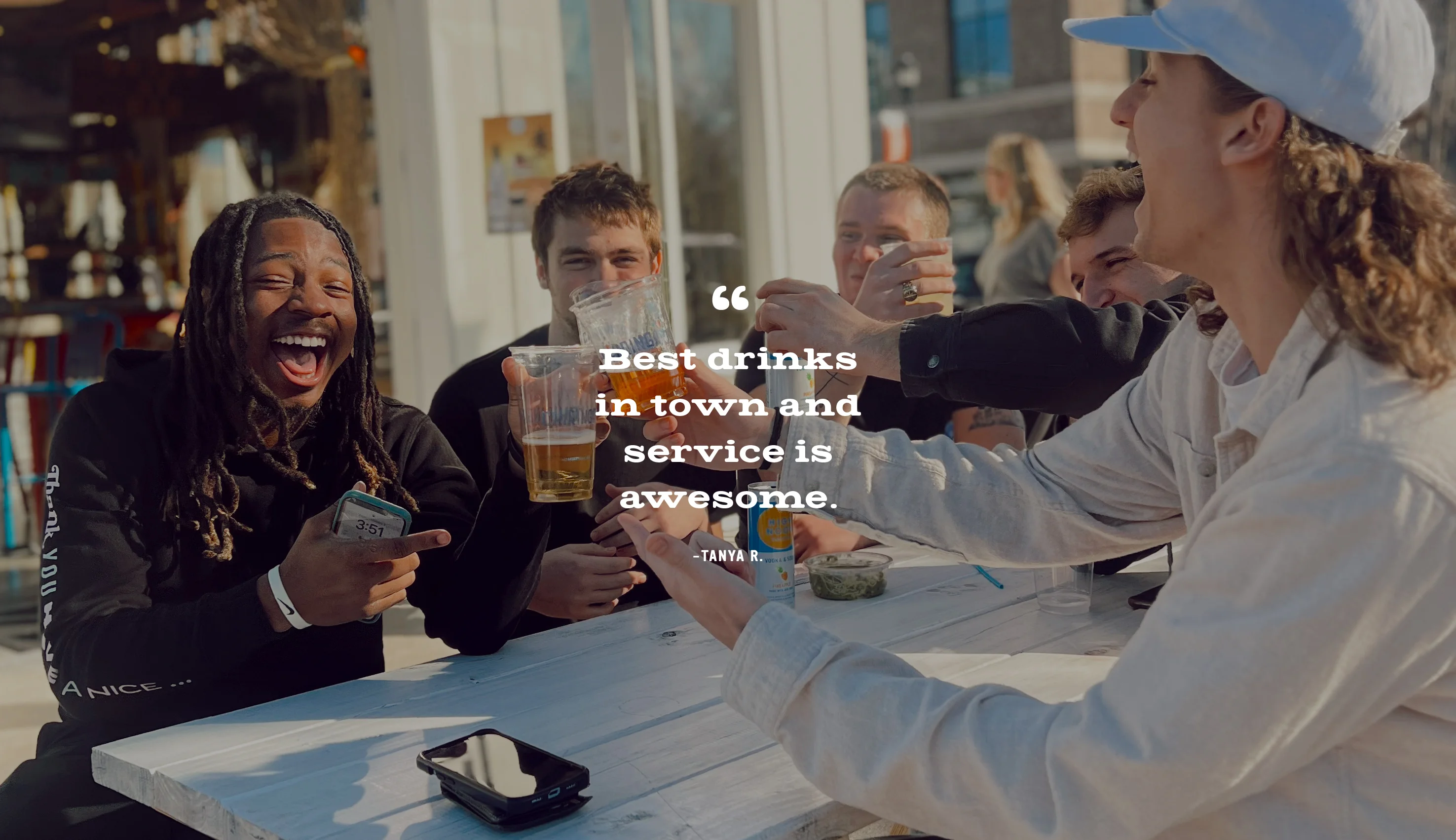 A photo of friends toasting. “Best drinks in town and  service is awesome.”