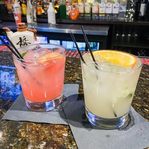 Colorful cocktails at a vibrant bar counter