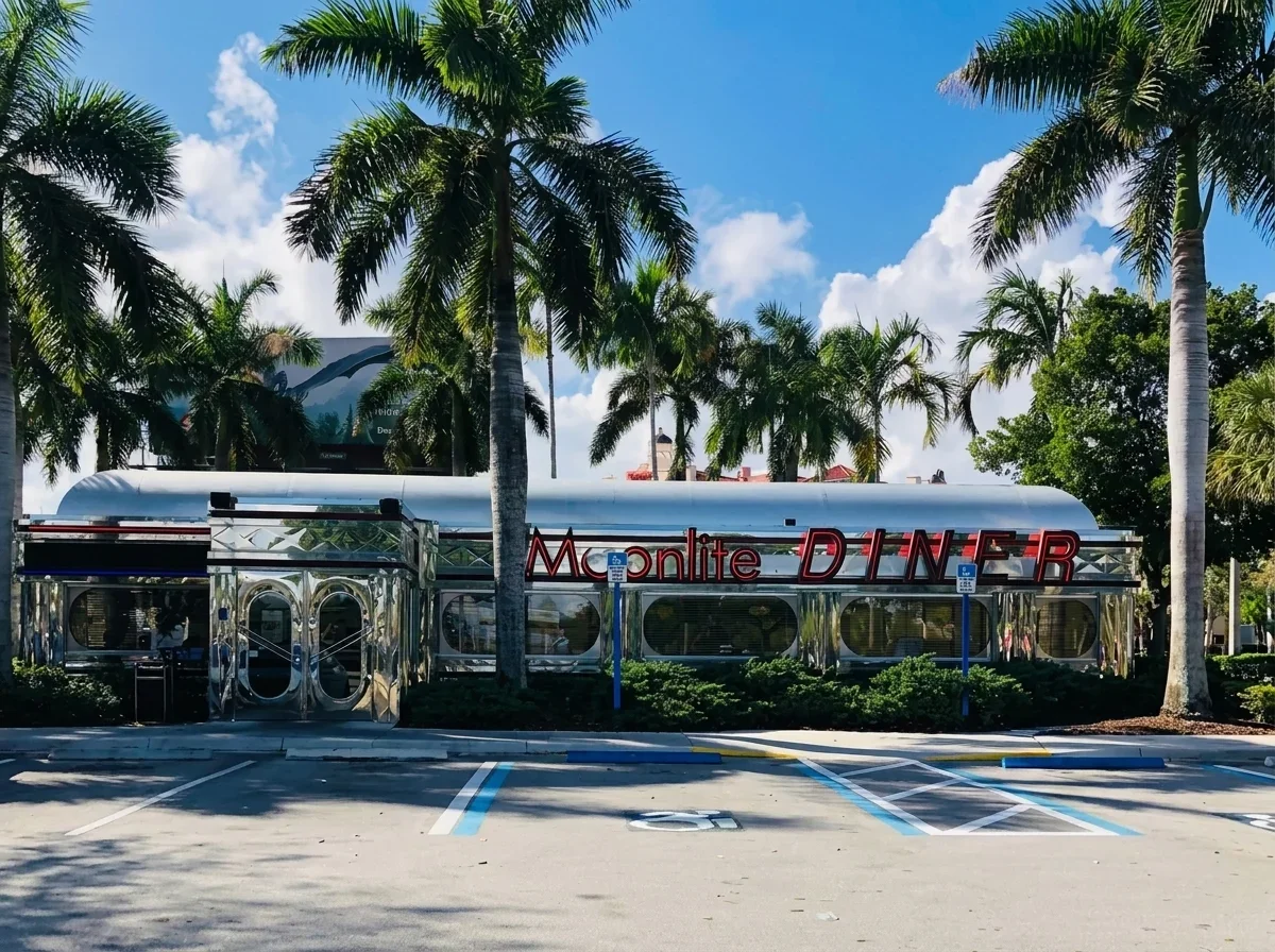 Classic American diner exterior with palm trees