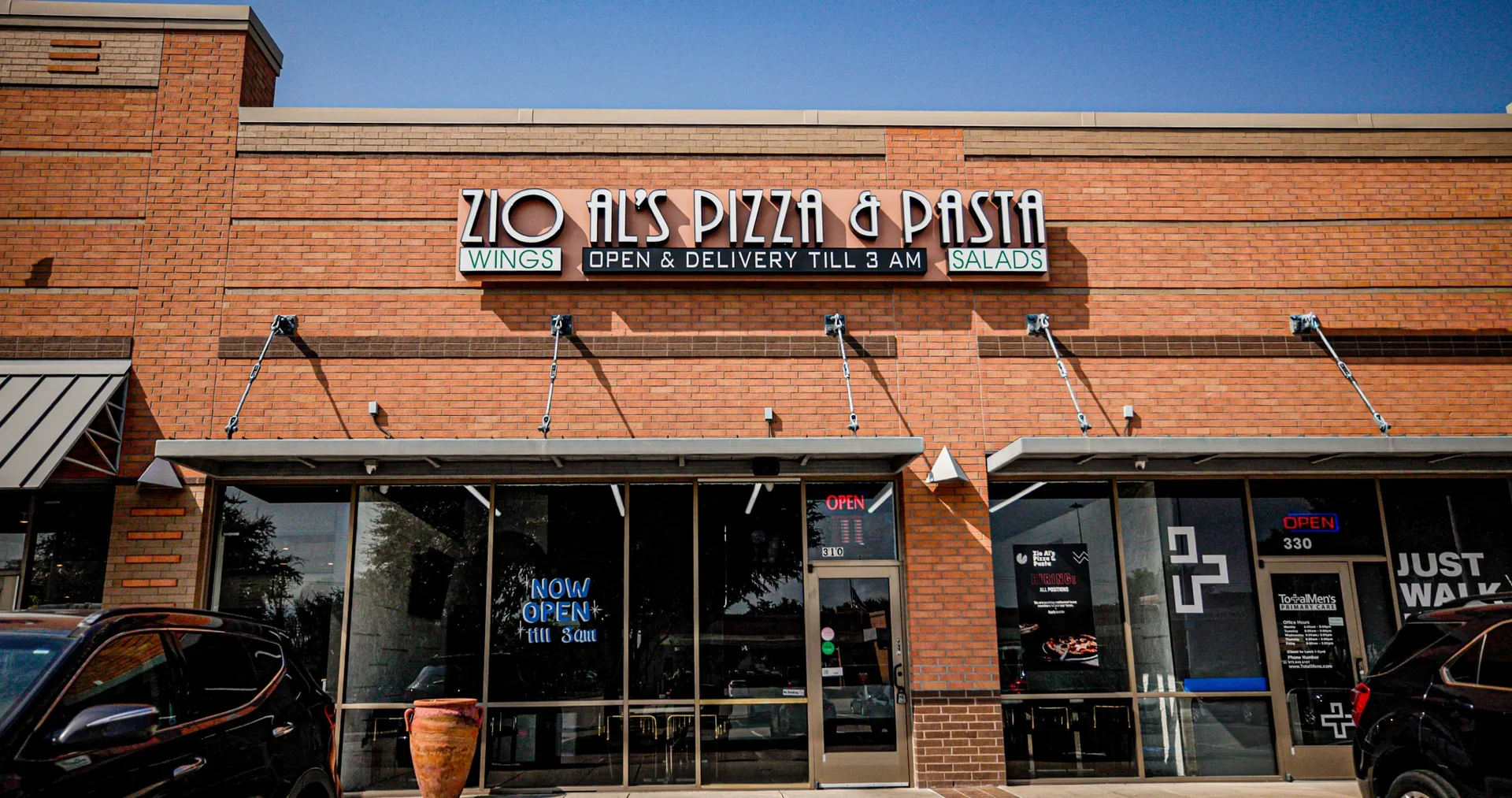 Exterior of Zio Al's Pizza & Pasta restaurant with open sign