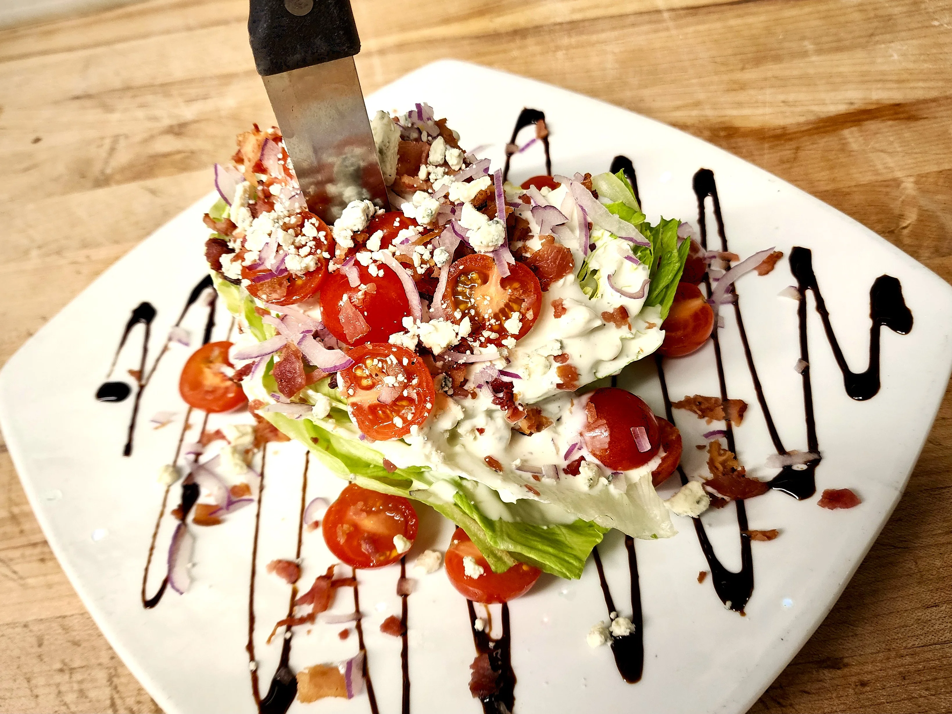 Classic wedge salad with bacon and tomatoes