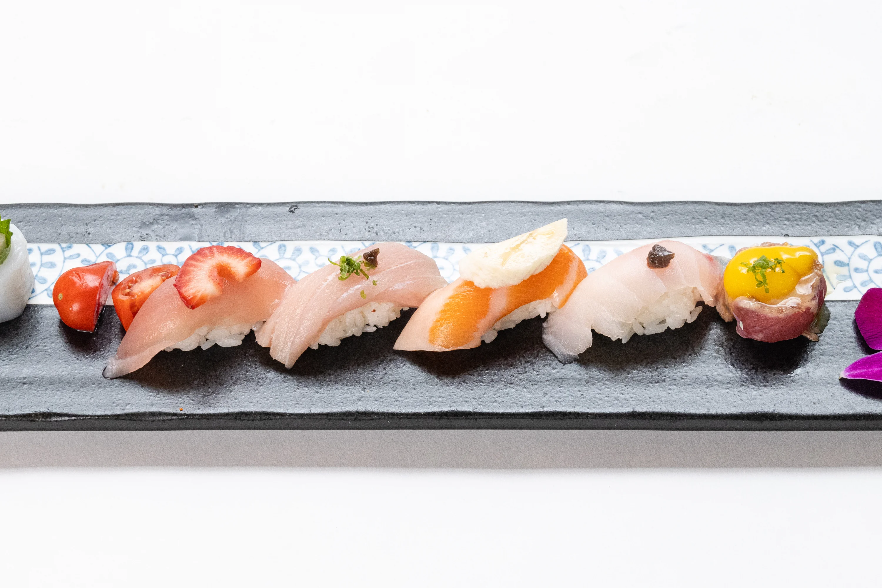 An artistic representation featuring stylized Japanese characters with a red circular accent.