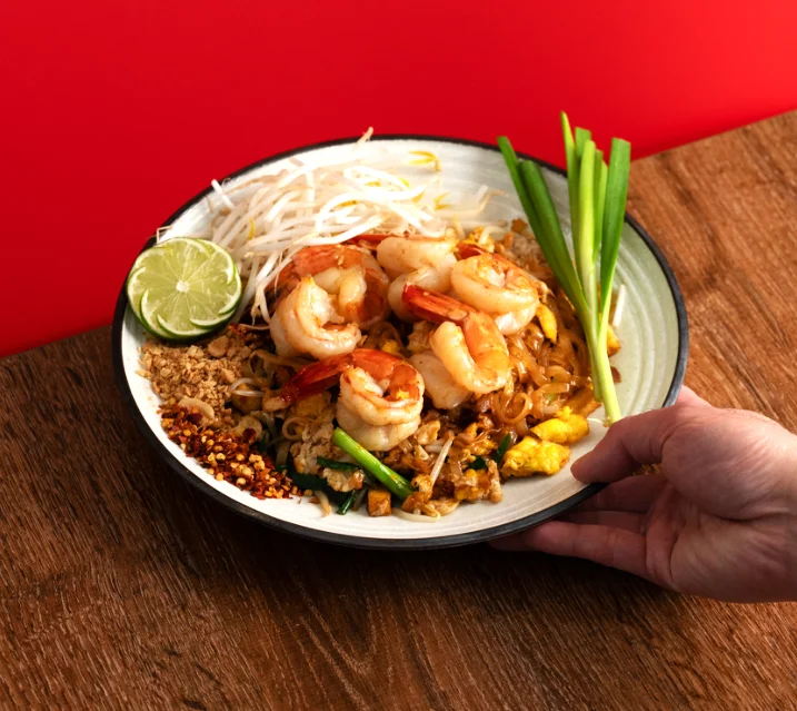 Spicy Thai tom yum noodle soup with shrimp and egg